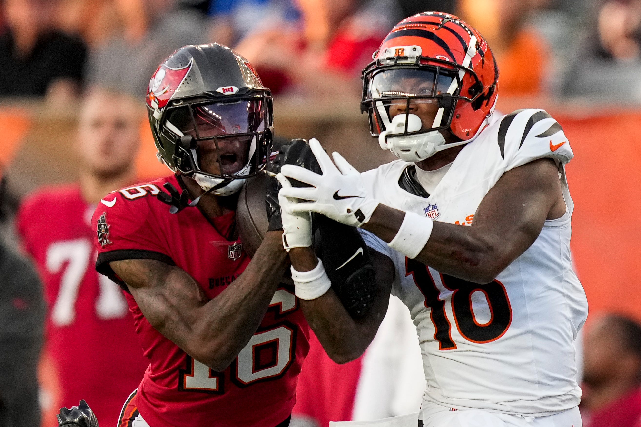 Tampa Bay Buccaneers cornerback Keenan Isaac (16) intercepts a pass intended for Cincinnati Bengals wide receiver Kwamie Lassiter II (18) in the second quarter of the NFL Preseason Week 1 game between the Cincinnati Bengals and the Tampa Bay Buccaneers at Paycor Stadium in downtown Cincinnati on Saturday, Aug. 10, 2024.