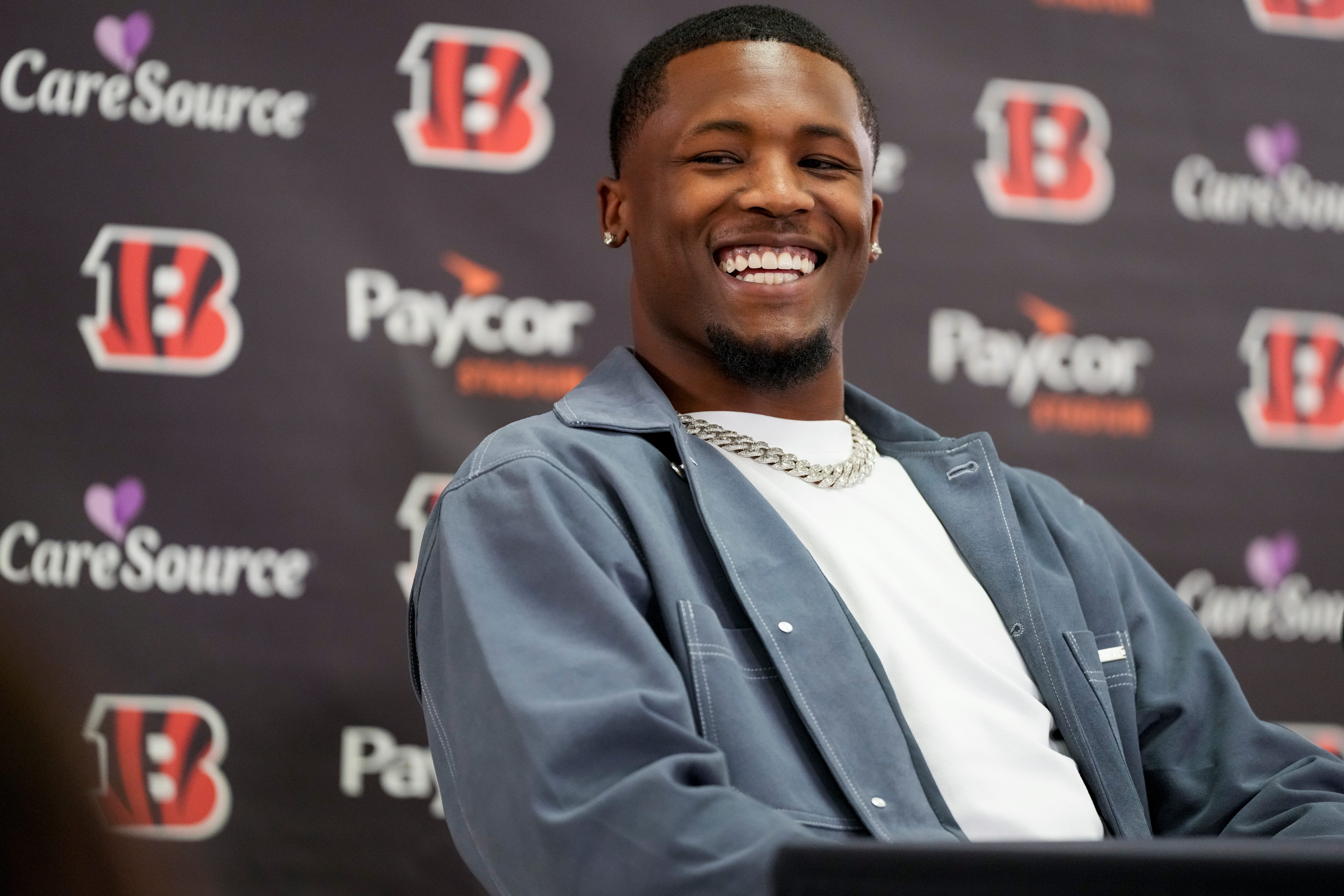 Tee Higgins smiles between questions during a press conference to announce the signing of new contracts for Cincinnati Bengals wide receivers Ja’Marr Chase and Tee Higgins at Paycor Stadium in downtown Cincinnati on Tuesday, March 18, 2025. Chase becomes the new highest-paid non-quarterback player in the NFL.