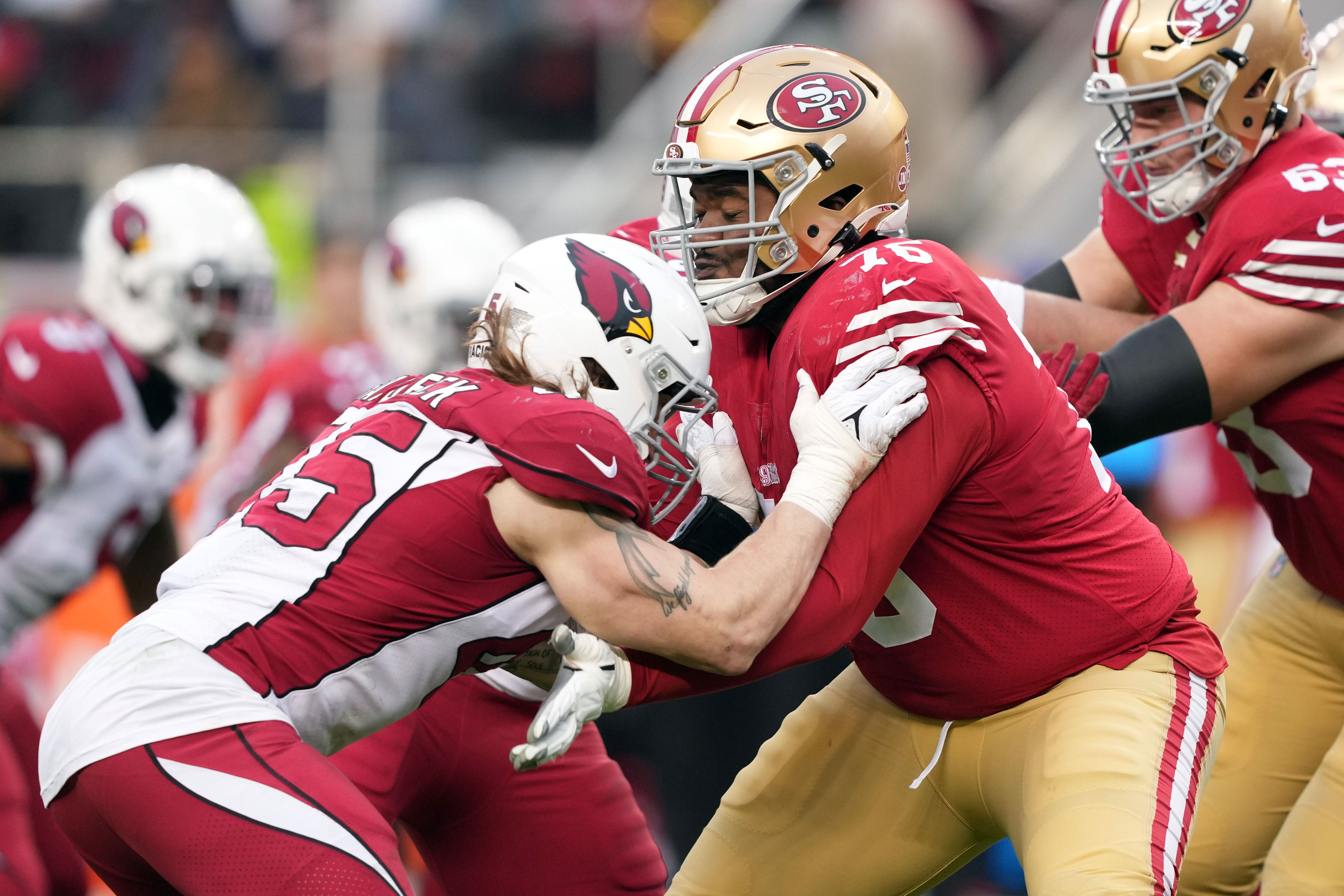 Jan 8, 2023; Santa Clara, California, USA; San Francisco 49ers guard Jaylon Moore (76) blocks Arizona Cardinals linebacker Dennis Gardeck (45) during the fourth quarter at Levi's Stadium.