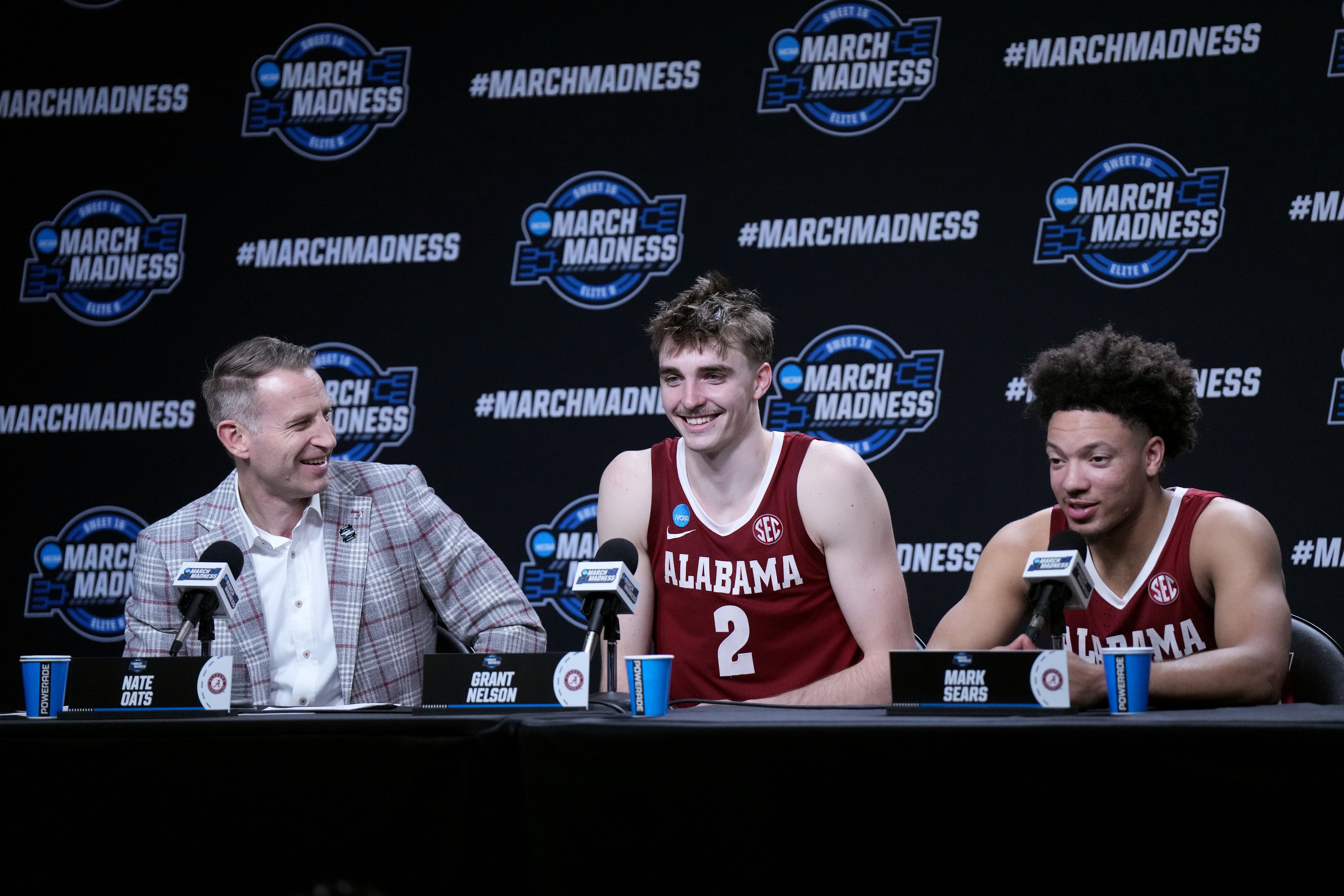 Mar 28, 2024; Los Angeles, CA, USA; Alabama Crimson Tide head coach Nate Oats talks with forward Grant Nelson (2) and guard Mark Sears (1) in a press conference after the game against the North Carolina Tar Heels. and in the semifinals of the West Regional of the 2024 NCAA Tournament at Crypto.com Arena.