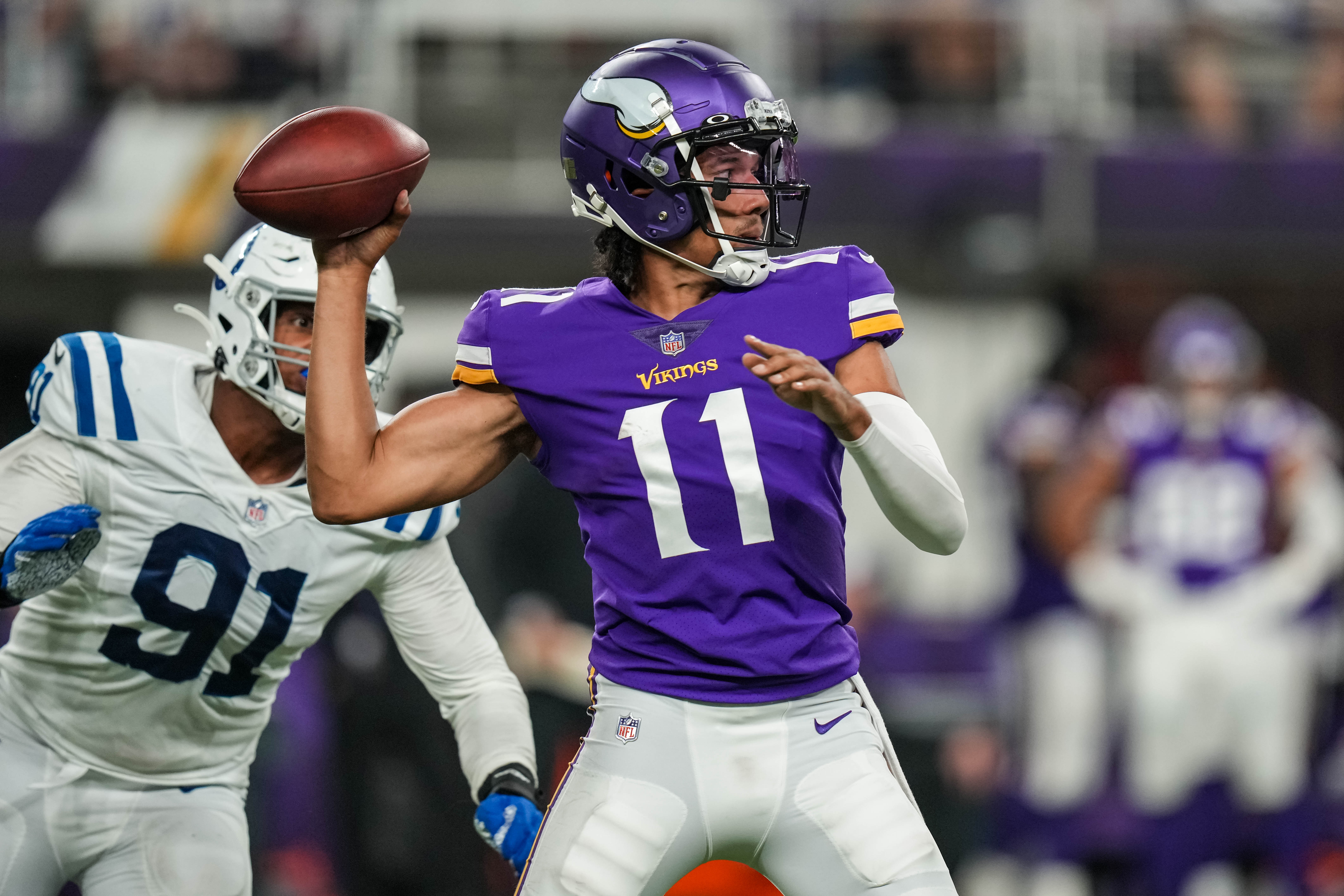 Aug 21, 2021; Minneapolis, Minnesota, USA; Minnesota Vikings quarterback Kellen Mond (11) throws in front of Indianapolis Colts defensive end Isaac Rochell (91) during the third quarter at U.S. Bank Stadium.