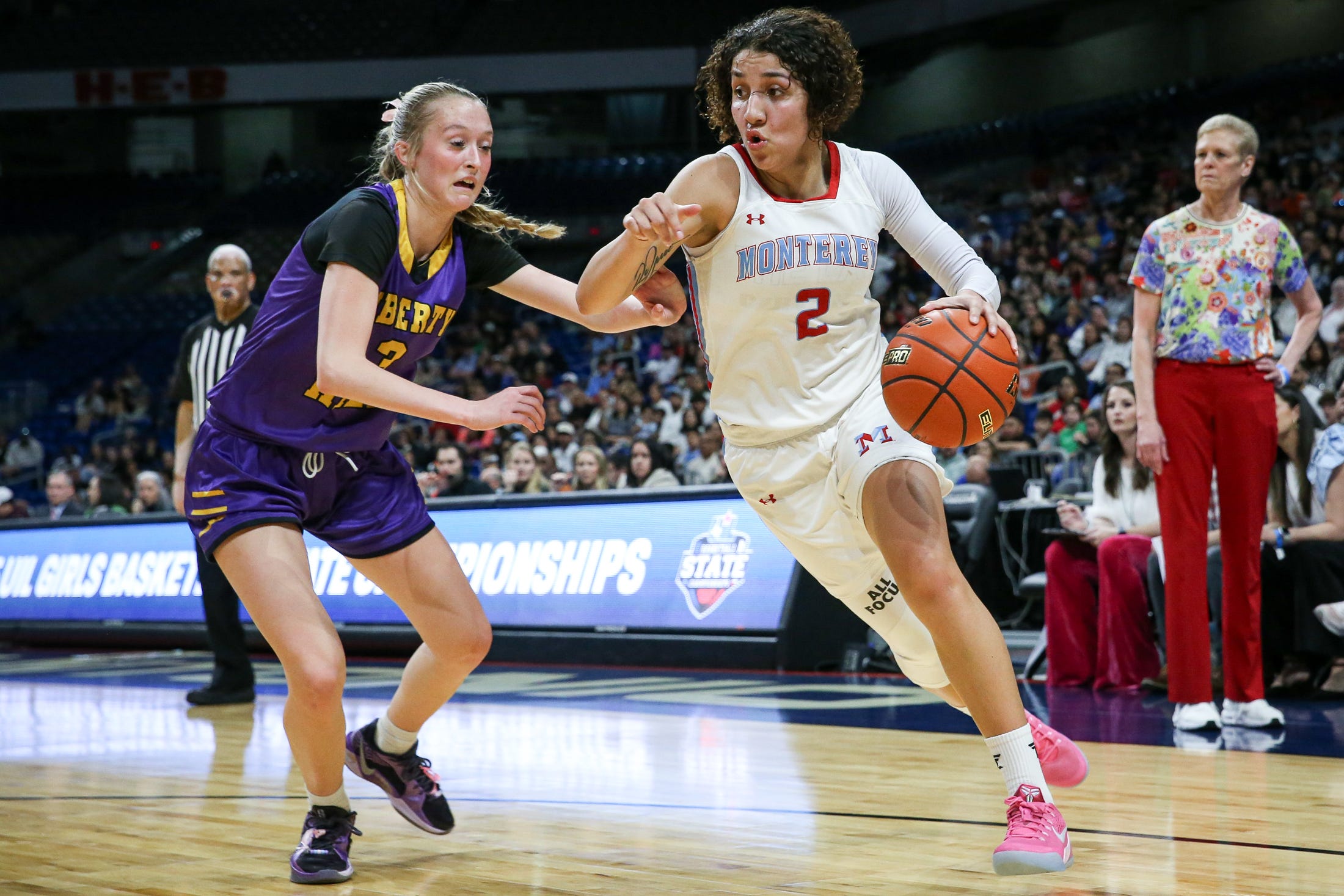 Monterey's Aaliyah Chavez dribbles past Liberty Hill's Reagan Robbins during the Class 5A Division II state championship girls basketball game on Saturday, March 1, 2025, at the Alamodome in San Antonio.