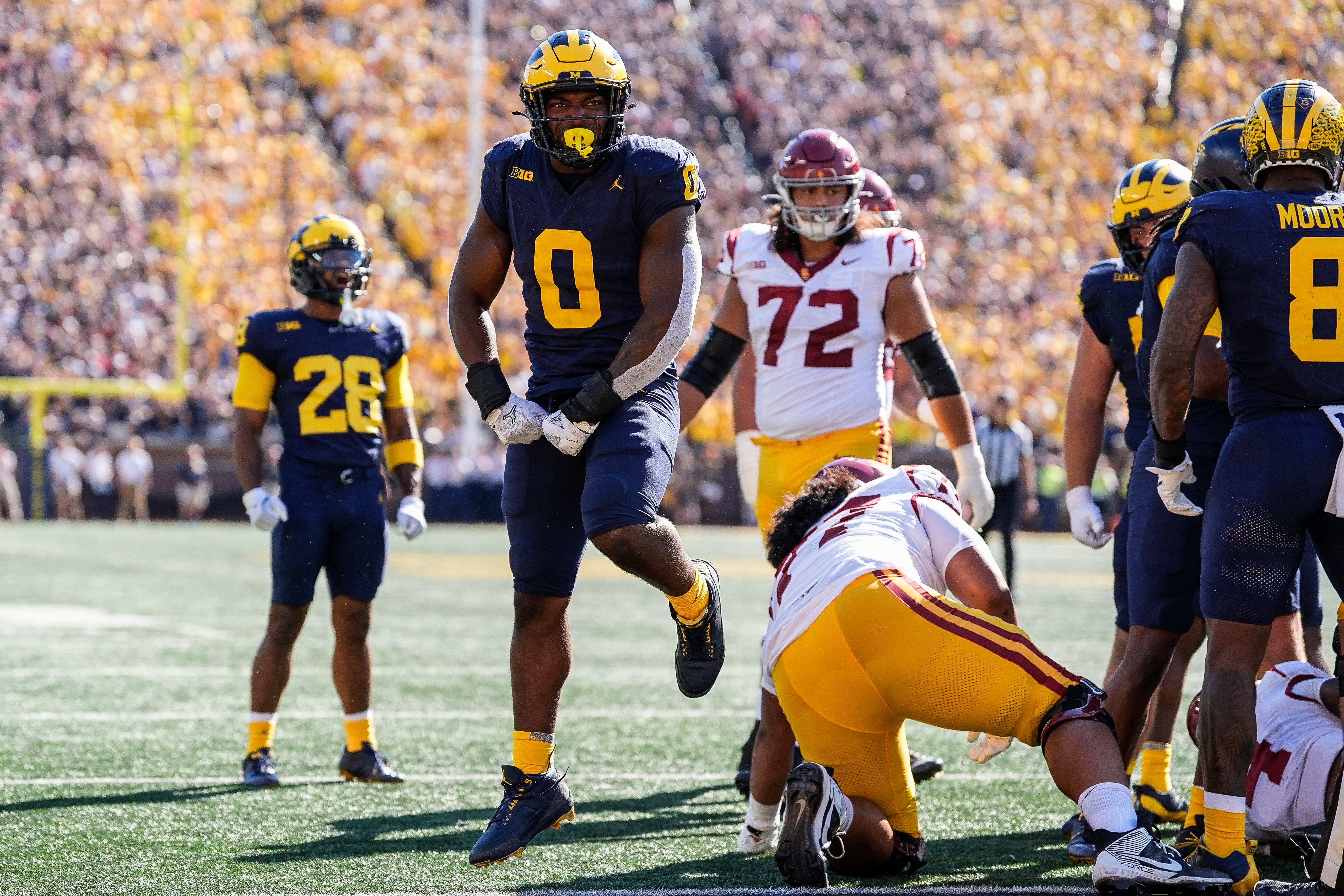 Michigan defensive end Josaiah Stewart (0) celebrates a tackle against USC during the first half at Michigan Stadium in Ann Arbor on Saturday, Sept. 21, 2024.  