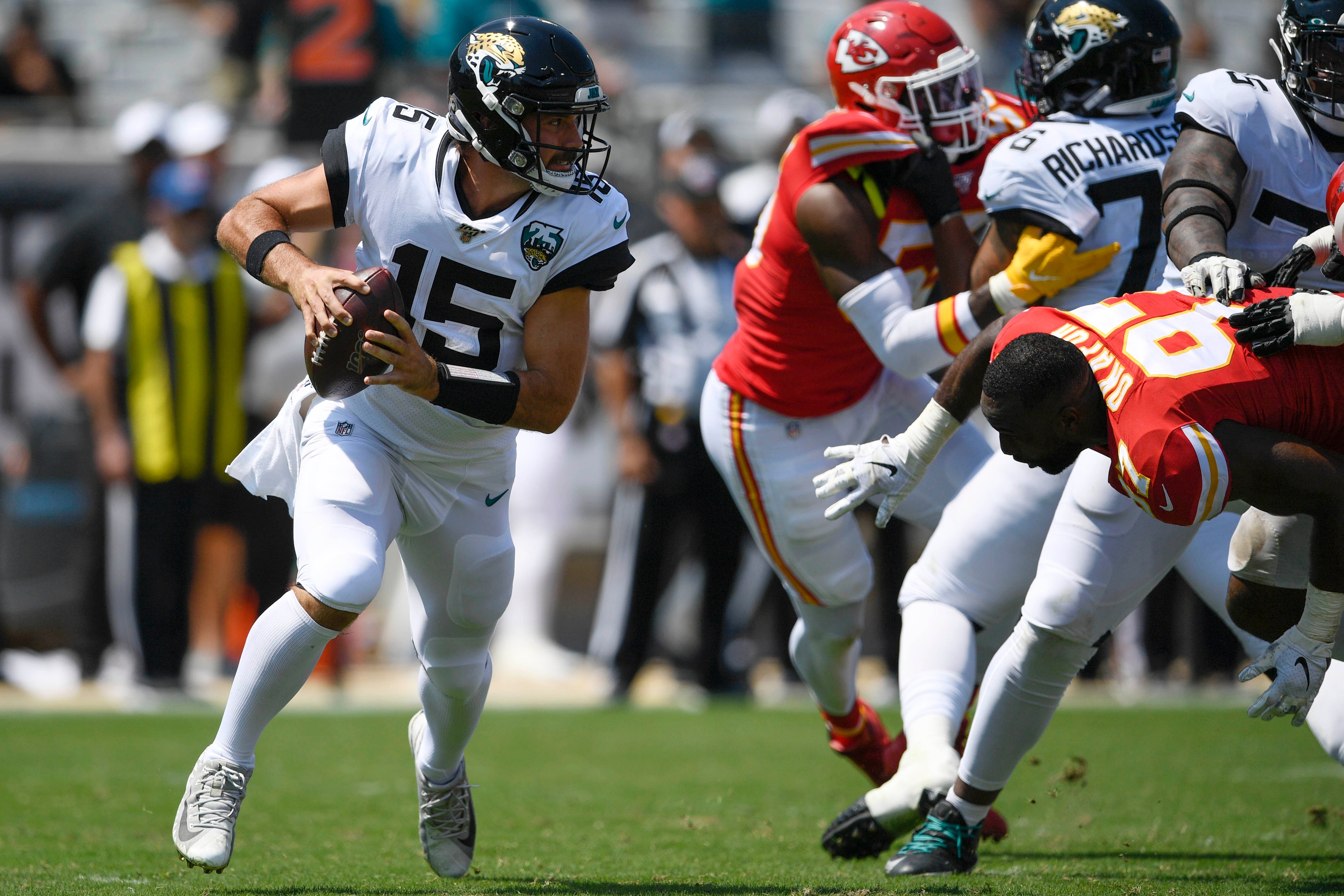 Jaguars quarterback Gardner Minshew II (15) scrambles with the ball during the second quarter against the Chiefs at TIAA Bank Field.