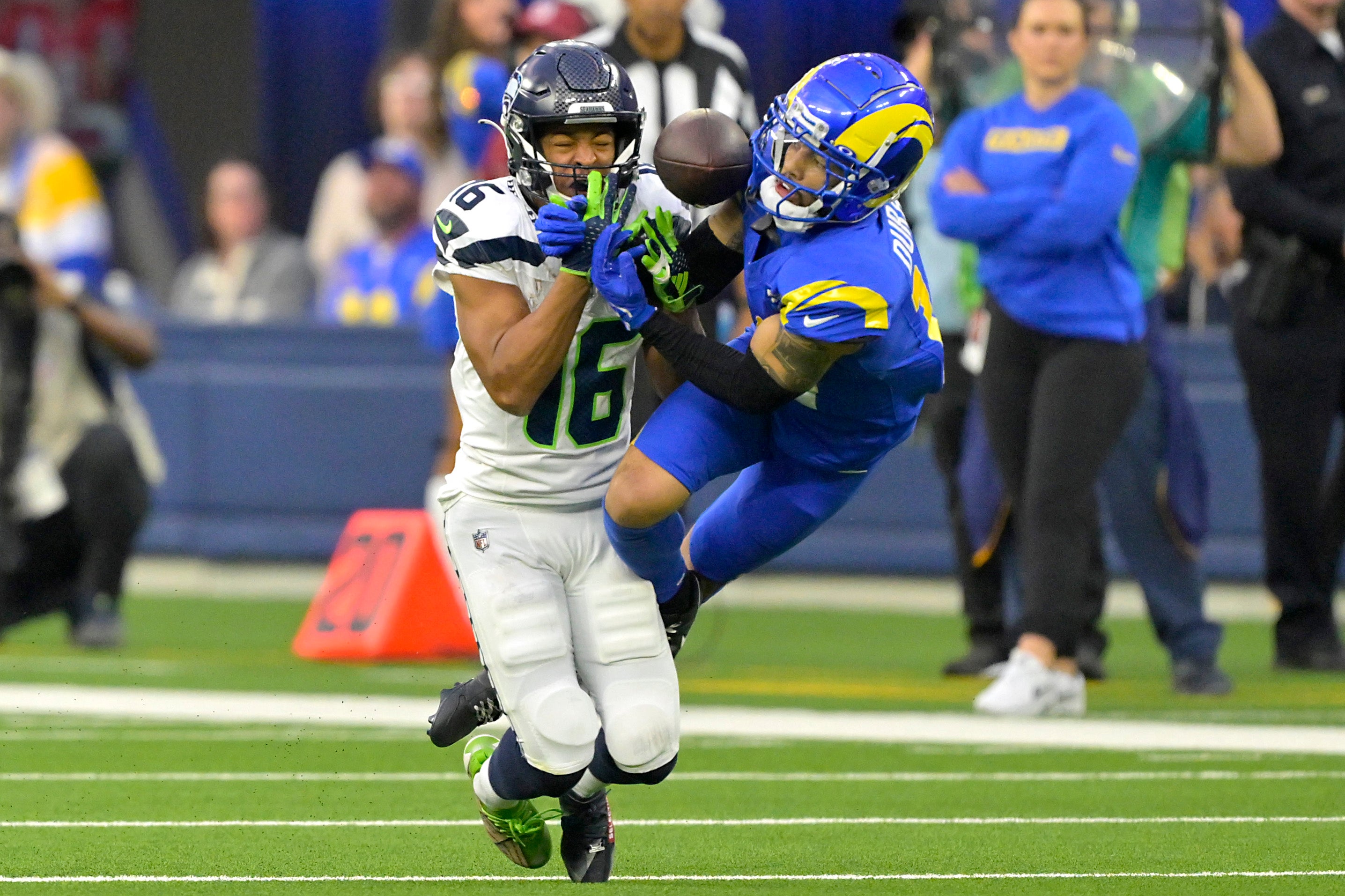 Jan 5, 2025; Inglewood, California, USA; Los Angeles Rams cornerback Cobie Durant (14) breaks up a pass for Seattle Seahawks wide receiver Tyler Lockett (16) in the second half against at SoFi Stadium.