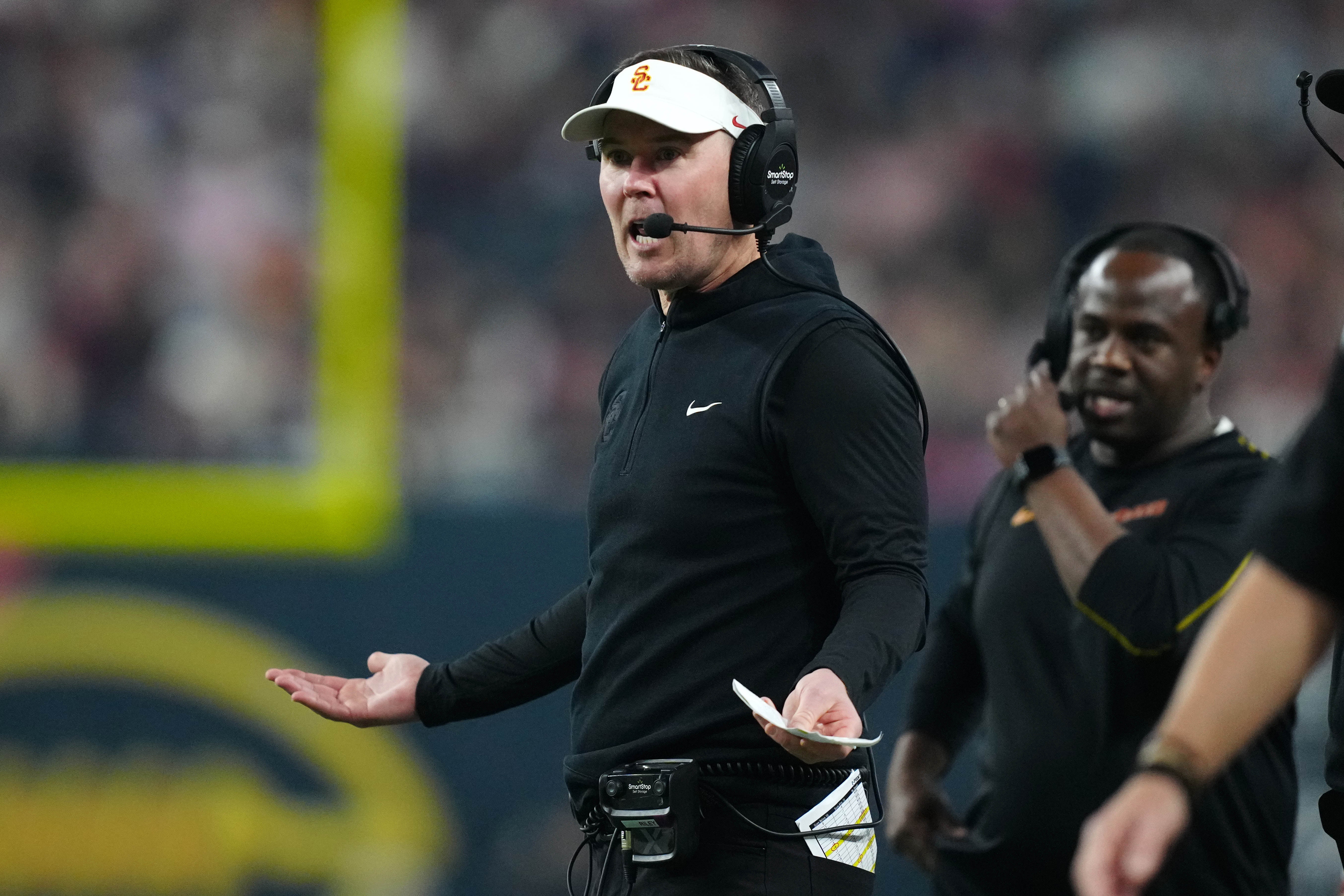 Dec 27, 2024; Las Vegas, NV, USA; Southern California Trojans head coach Lincoln Riley reacts against the Texas A&M Aggies in the first half at Allegiant Stadium.