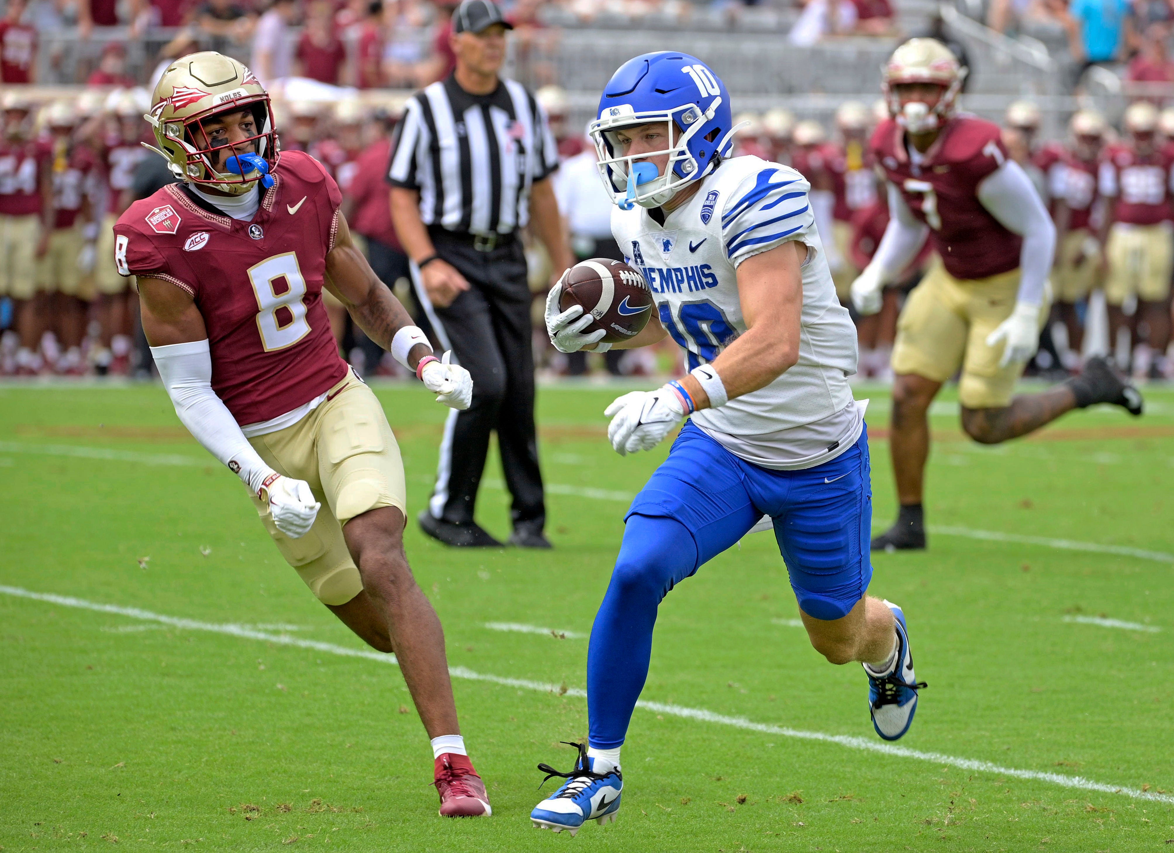 Sep 14, 2024; Tallahassee, Florida, USA; Memphis Tigers wide receiver Koby Drake (10) runs the ball against Florida State Seminoles defensive back Azareye'h Thomas (8) during the first half at Doak S. Campbell Stadium.