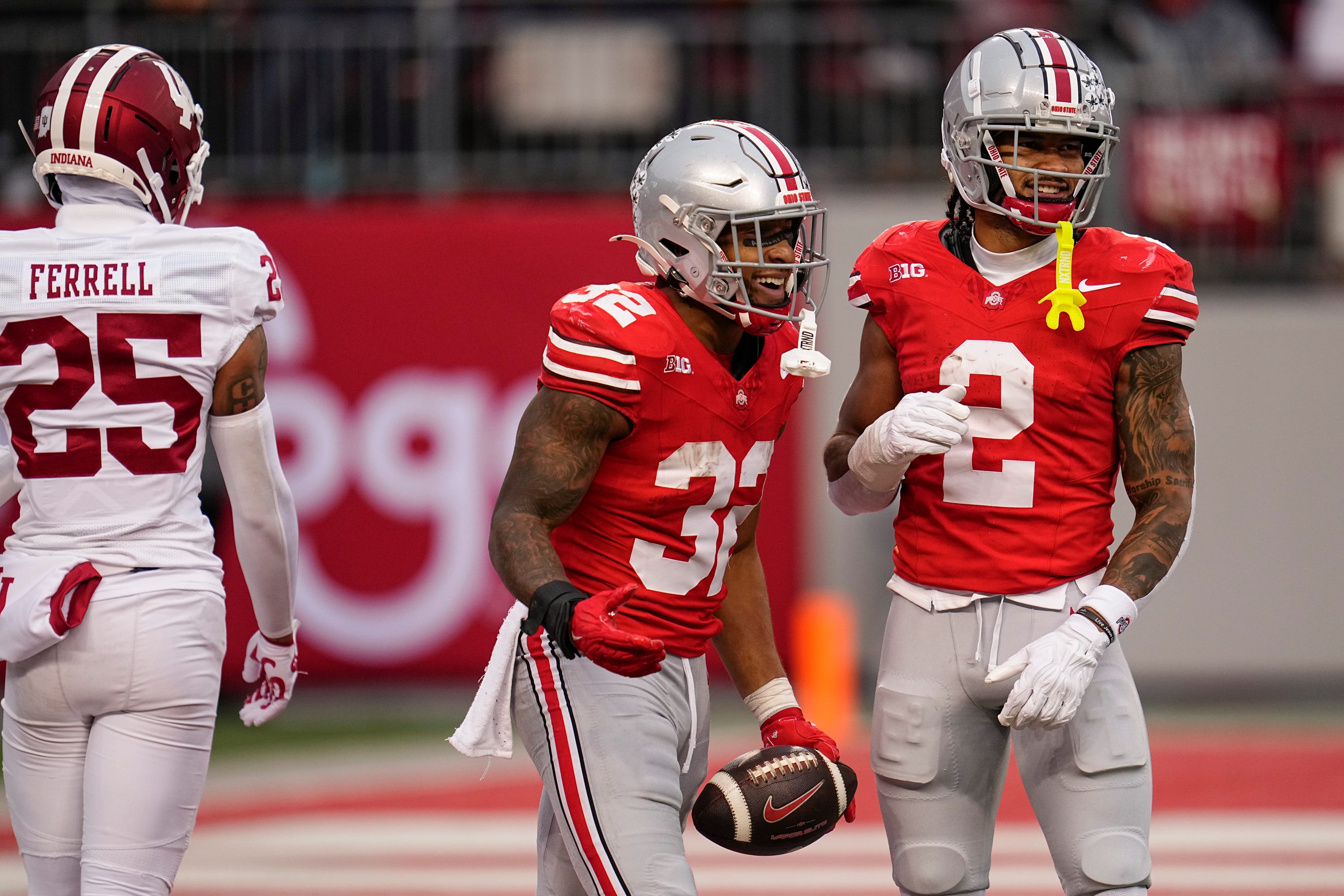 Ohio State Buckeyes running back TreVeyon Henderson (32) celebrates with wide receiver Emeka Egbuka (2) during the second half of the NCAA football game against the Indiana Hoosiers at Ohio Stadium in Columbus on Saturday, Nov. 23, 2024. Henderson slid at the 1-yard line to seal the game. Ohio State won 38-15.