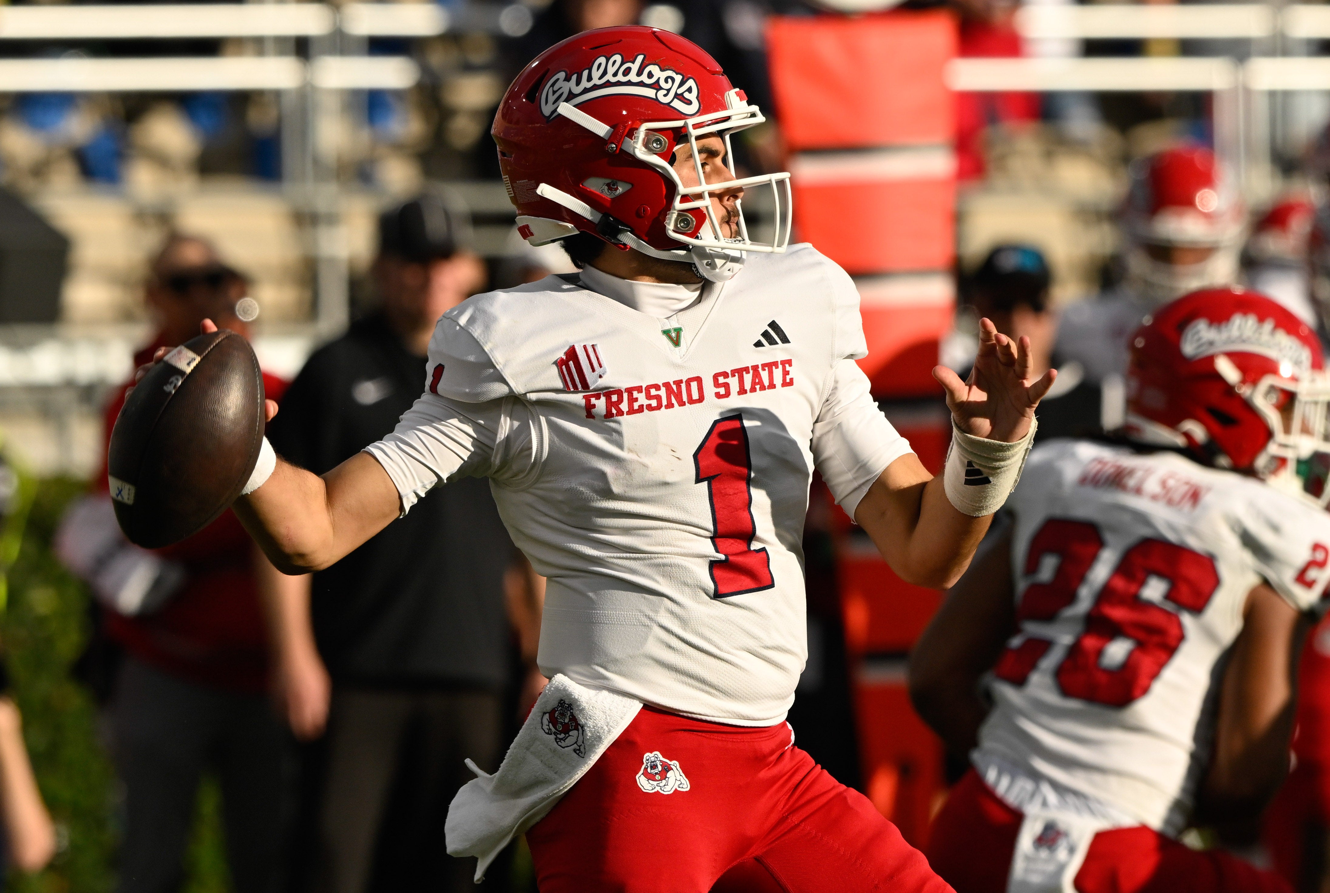 Nov 30, 2024; Pasadena, California, USA; Fresno State Bulldogs quarterback Mikey Keene (1) looks for a receiver during the third quarter against the UCLA Bruins at Rose Bowl.