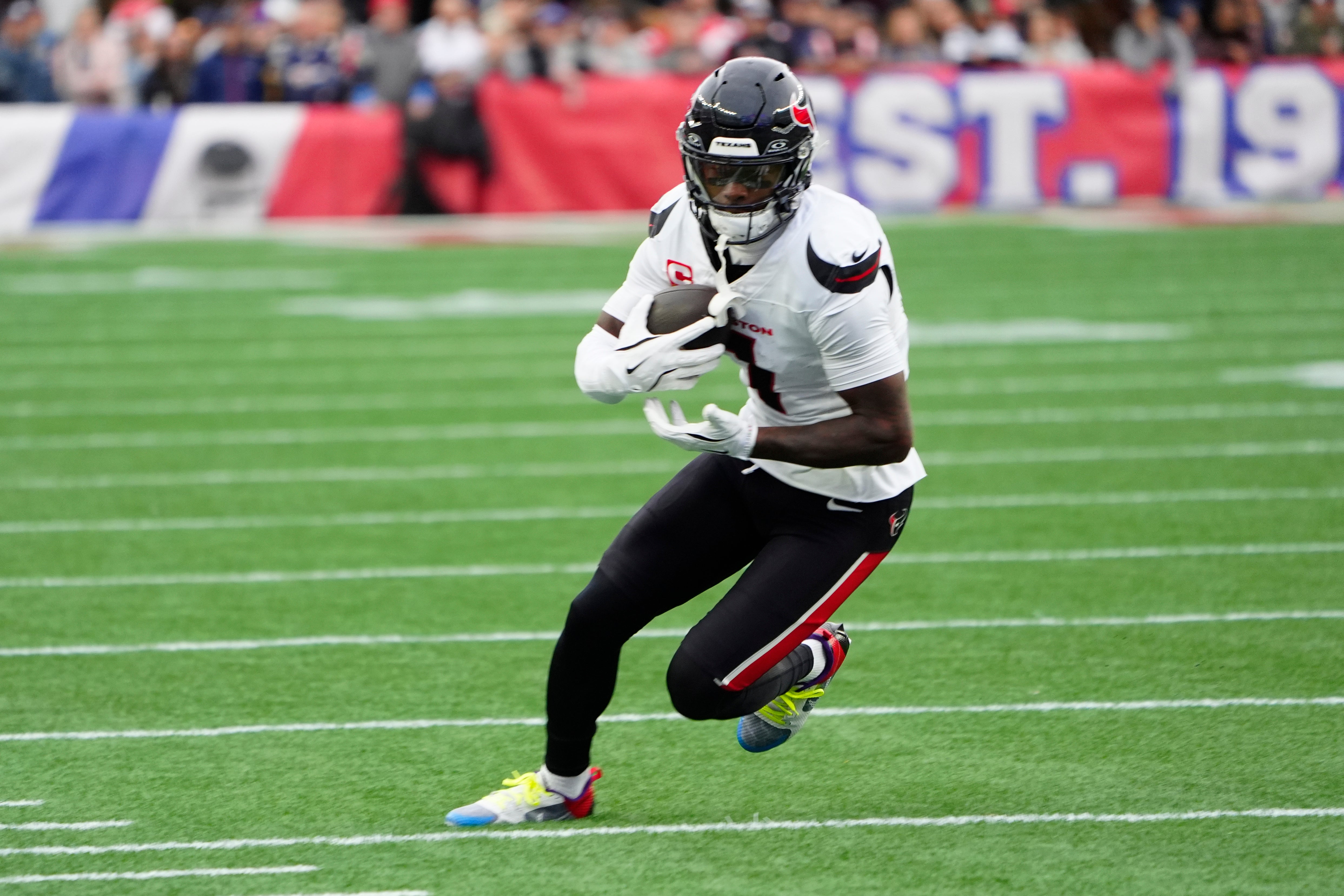 Oct 13, 2024; Foxborough, Massachusetts, USA; Houston Texans wide receiver Stefon Diggs (1) runs with the ball after making a catch against the New England Patriots during the first half at Gillette Stadium.