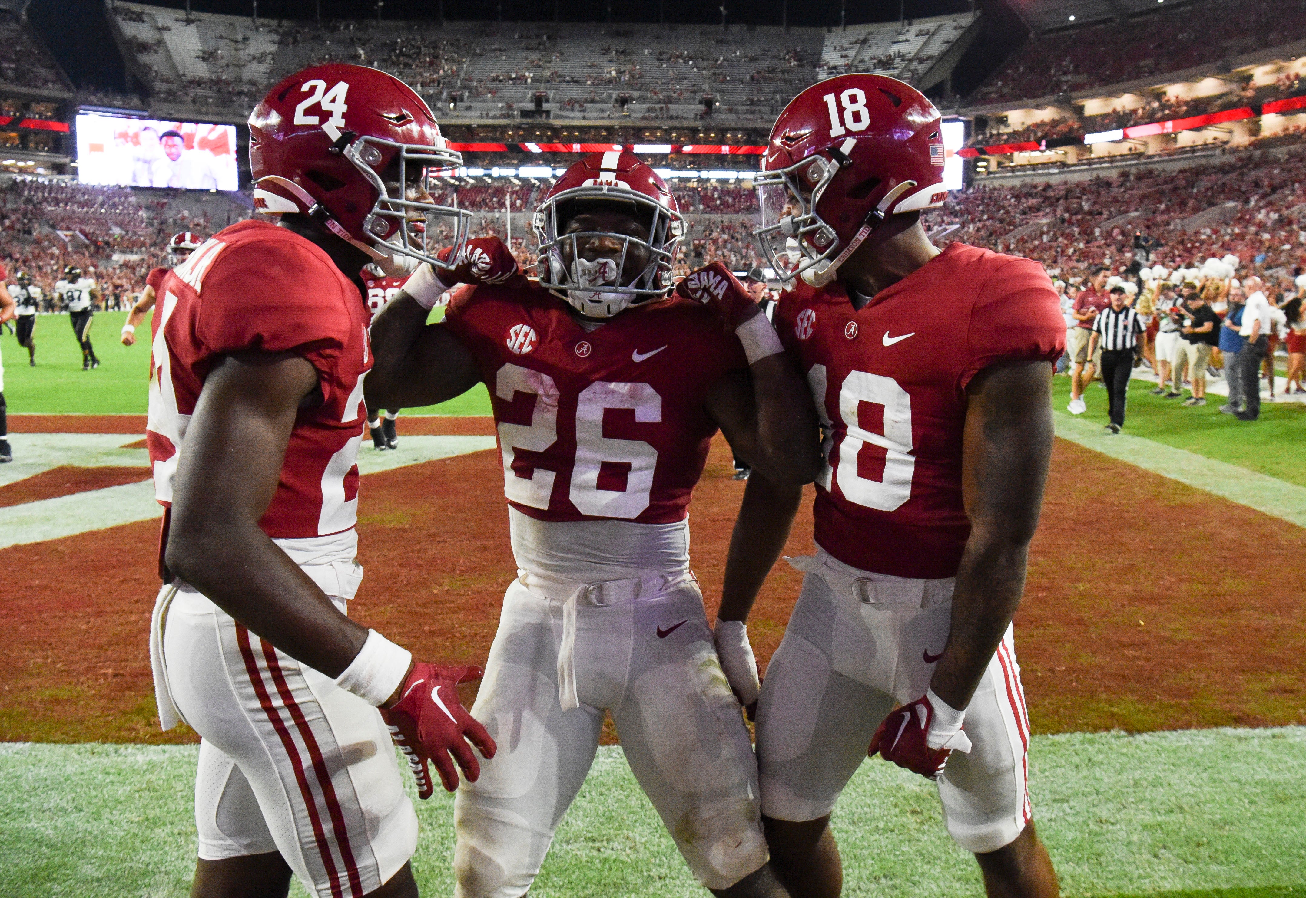 Jamarion Miller celebrates a score with Alabama teammates