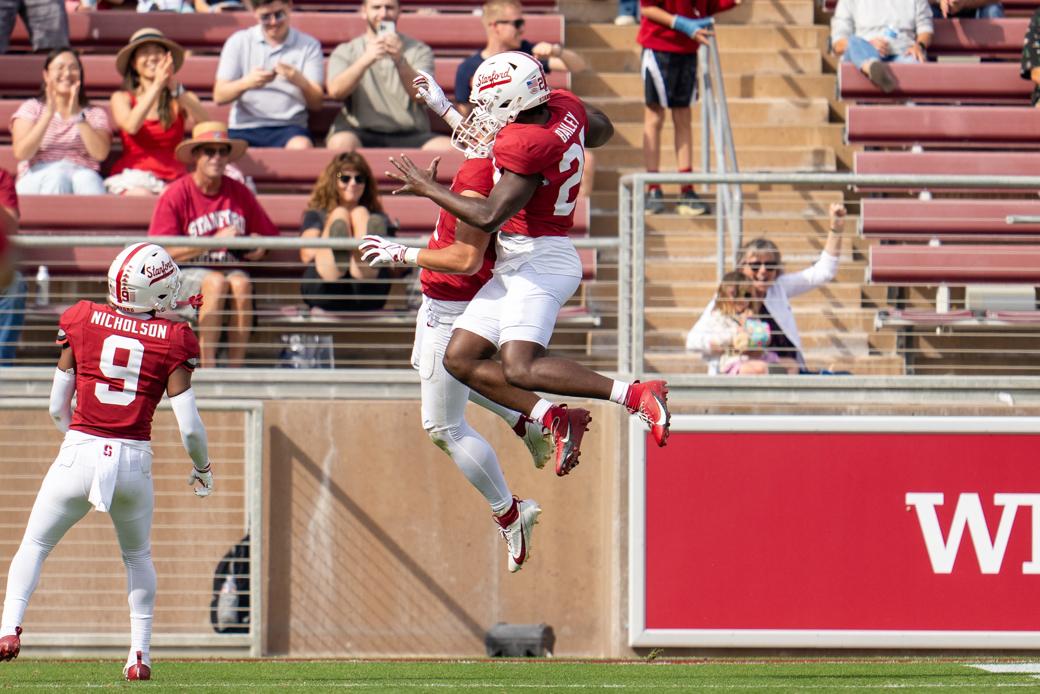 Stanford Cardinal linebacker Tevarua Tafiti (11) and linebacker David Bailey (23) celebrate after a touchdown against the Wake Forest Demon Deacons in the second quarter at Stanford Stadium.