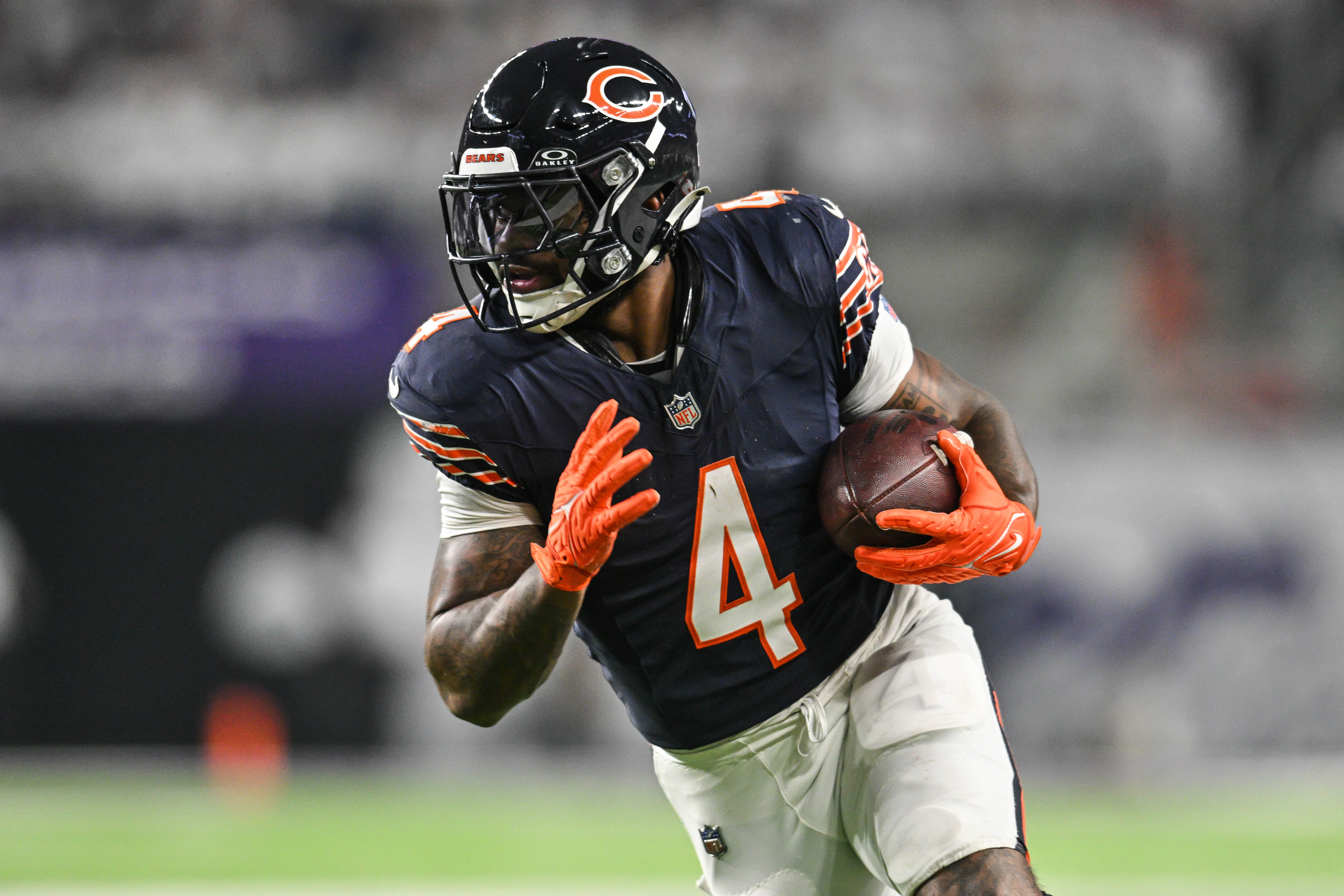 Dec 16, 2024; Minneapolis, Minnesota, USA; Chicago Bears running back D'Andre Swift (4) runs the ball against the Minnesota Vikings during the third quarter at U.S. Bank Stadium.