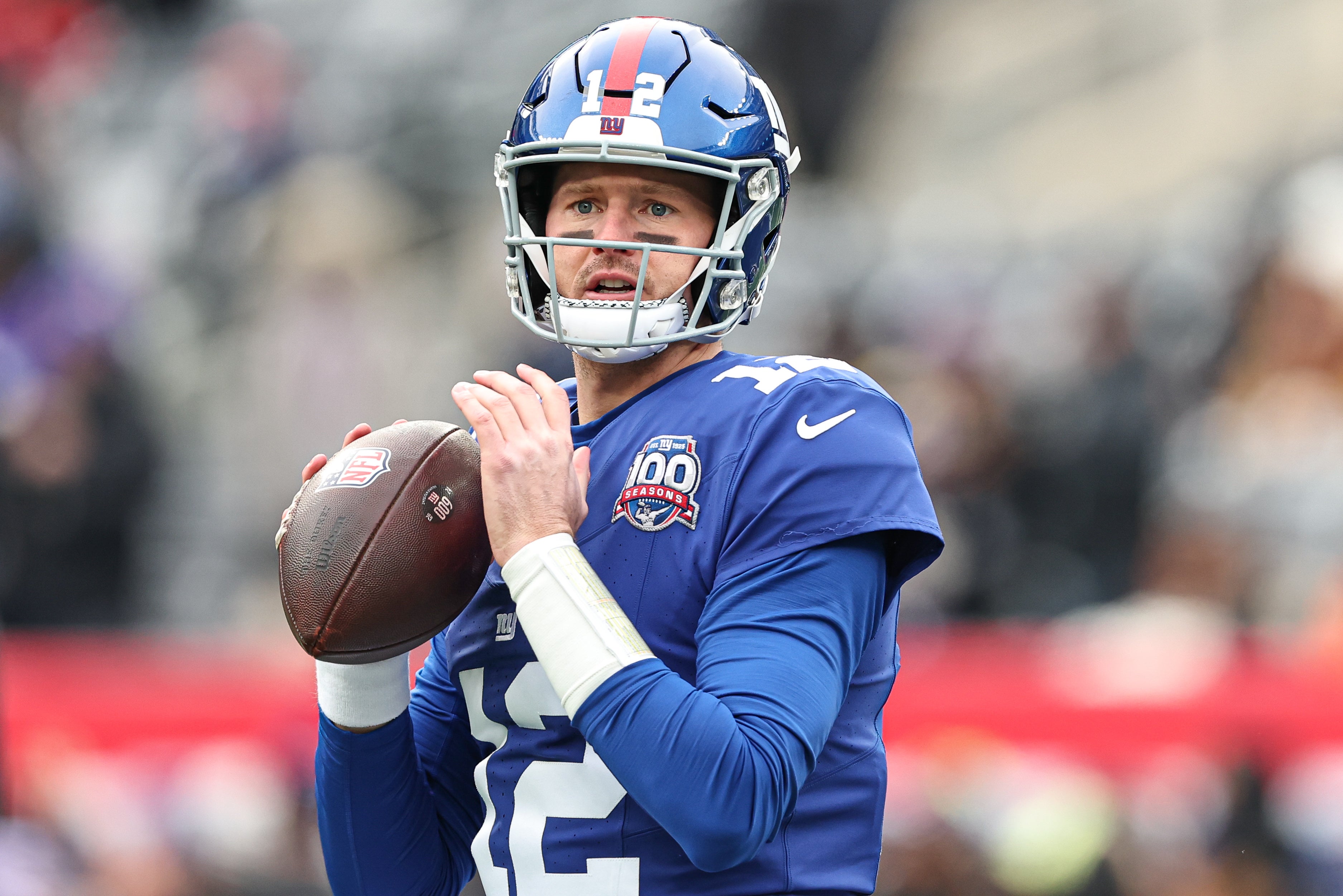 Dec 15, 2024; East Rutherford, New Jersey, USA; New York Giants quarterback Tim Boyle (12) warms up before the game against the Baltimore Ravens at MetLife Stadium. Mandatory Credit: Vincent Carchietta-Imagn Images