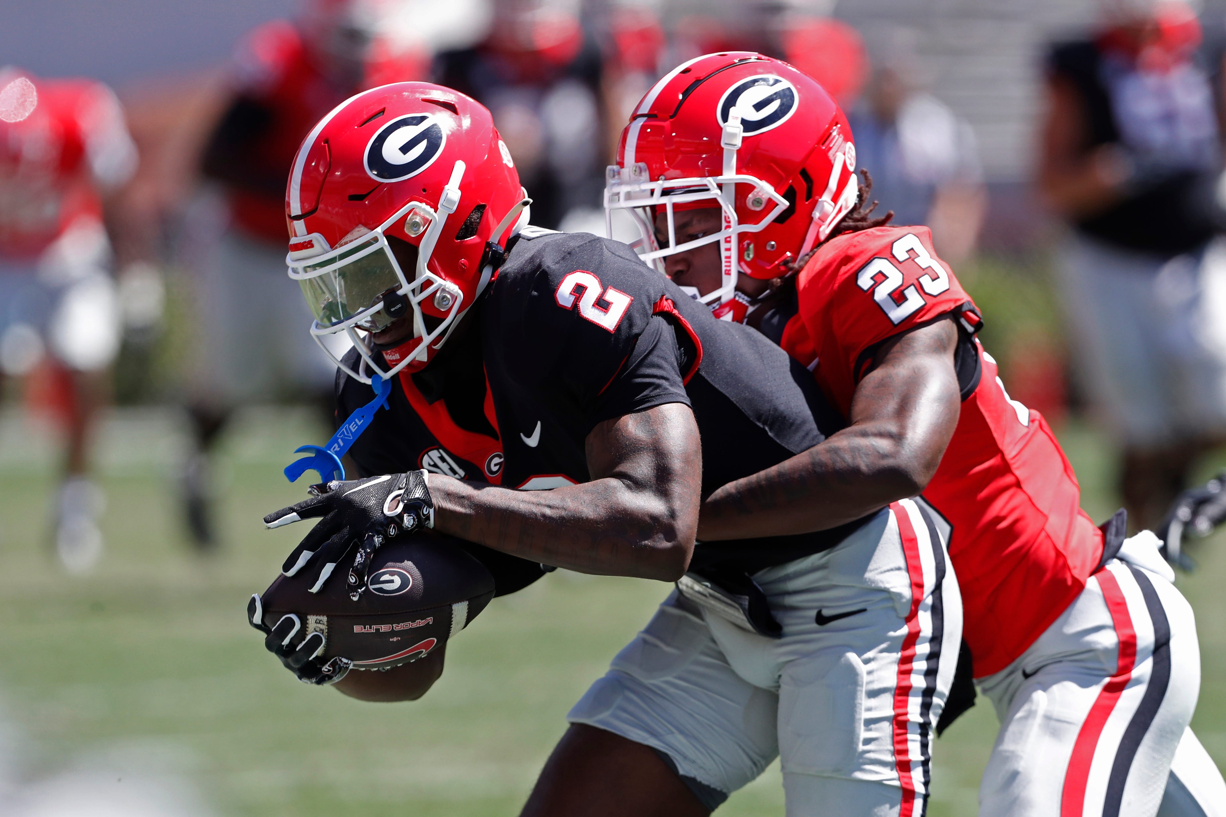 Georgia wide receiver Nitro Tuggle (2) catches a pass from Georgia quarterback Gunner Stockton (14) during the G-Day spring football game in Athens, Ga., on Saturday, April 13, 2024.