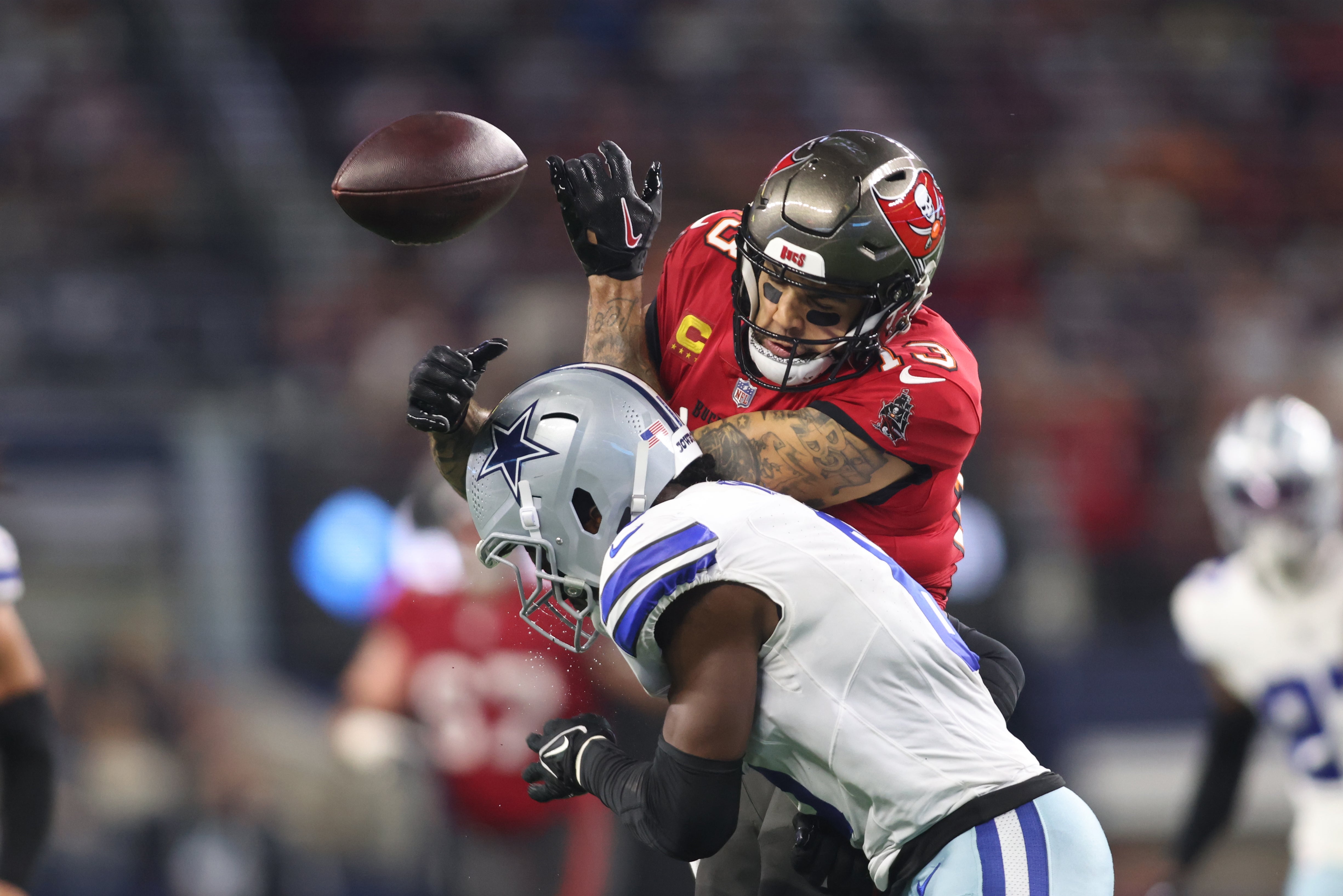 Dallas Cowboys safety Donovan Wilson (6) defends a pass against Tampa Bay Buccaneers wide receiver Mike Evans (13) in the second half at AT&T Stadium.