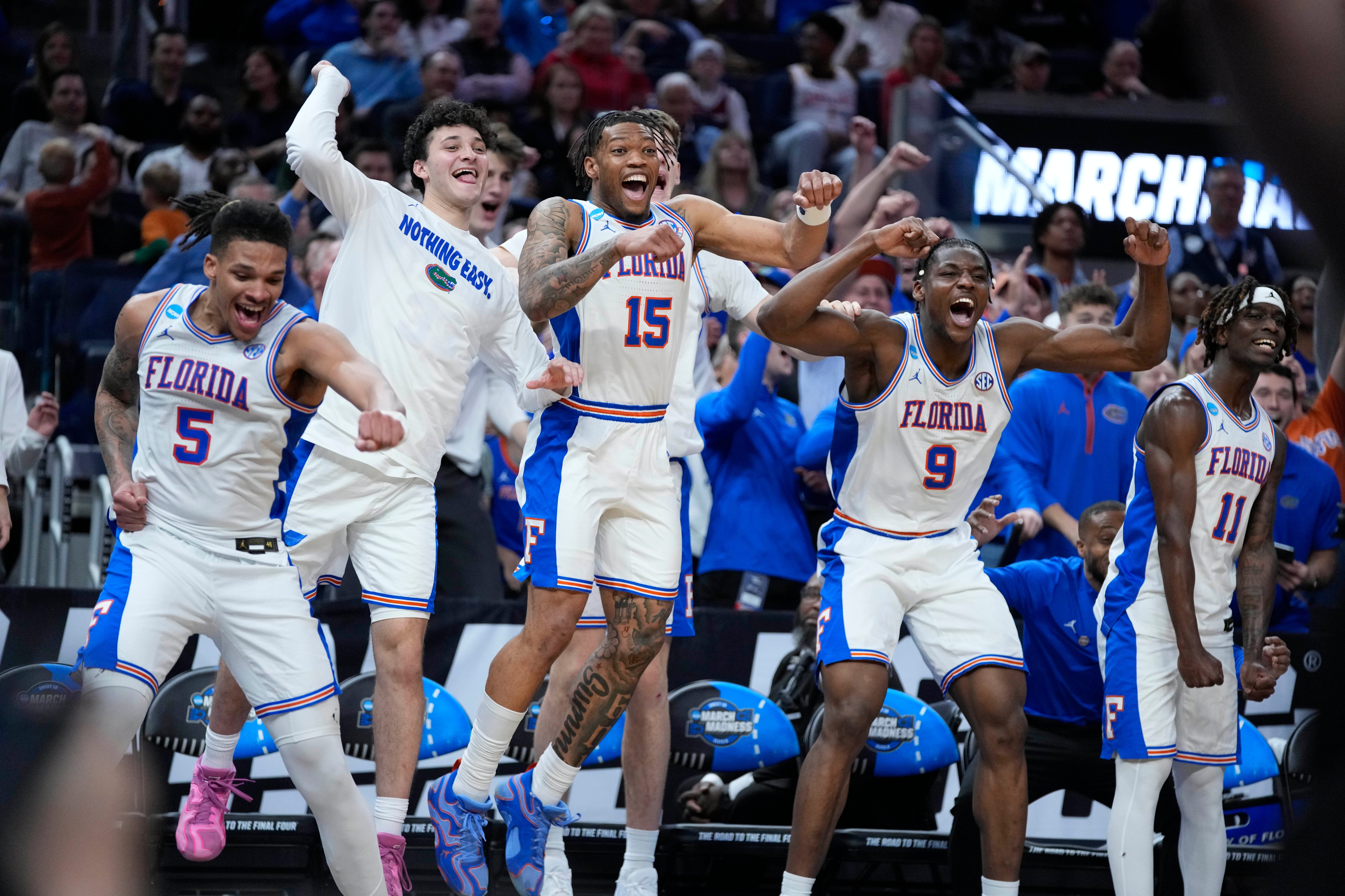 Mar 27, 2025; San Francisco, CA, USA; Florida Gators guard Alijah Martin (15), guard Will Richard (5) and center Rueben Chinyelu (9) celebrate on the Florida Gators bench during the second half against the Maryland Terrapins during a West Regional semifinal of the 2025 NCAA tournament at Chase Center.