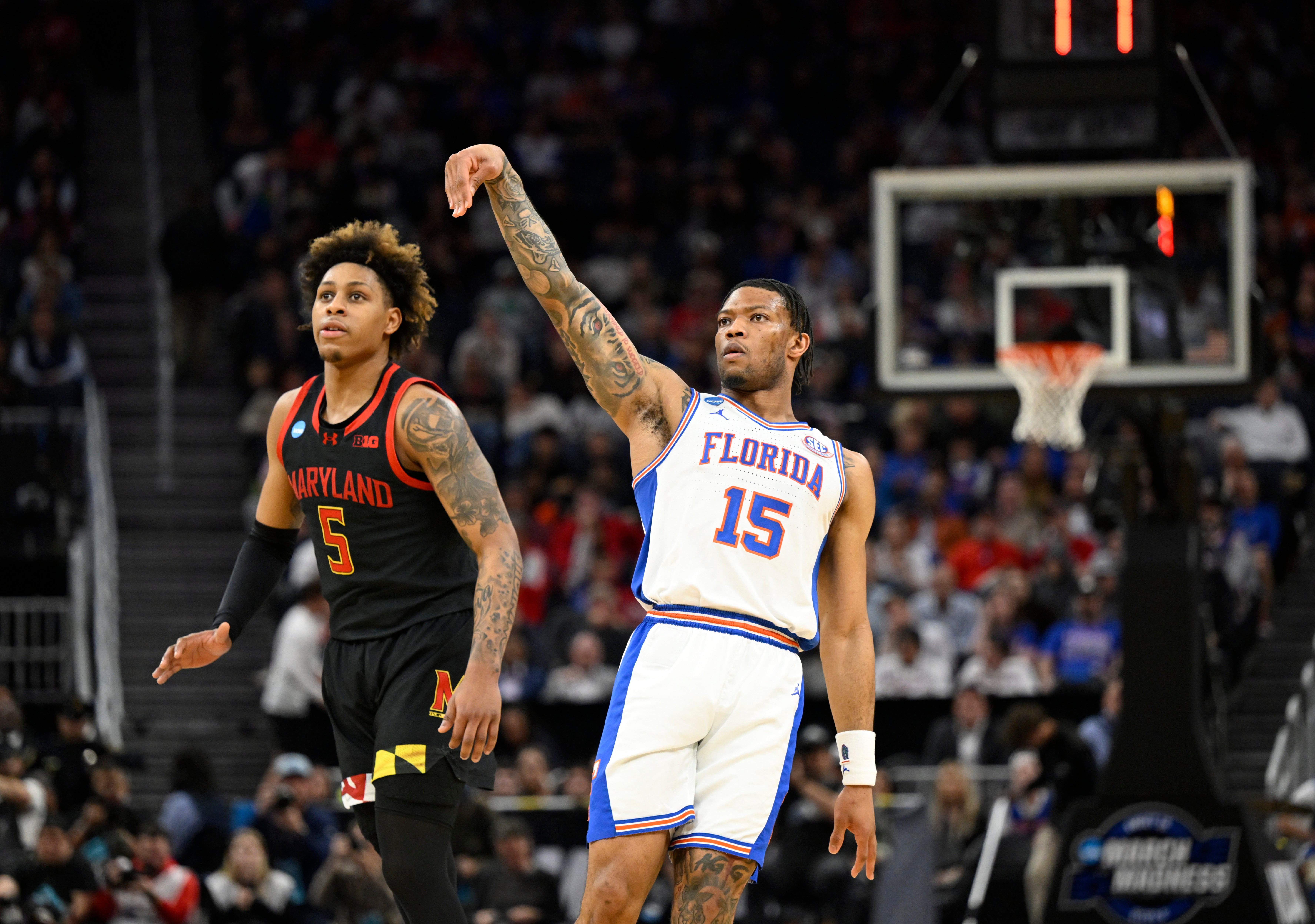 Mar 27, 2025; San Francisco, CA, USA; Florida Gators guard Alijah Martin (15) reacts after a three point basket over Maryland Terrapins guard DeShawn Harris-Smith (5) during the first half during a West Regional semifinal of the 2025 NCAA tournament at Chase Center.