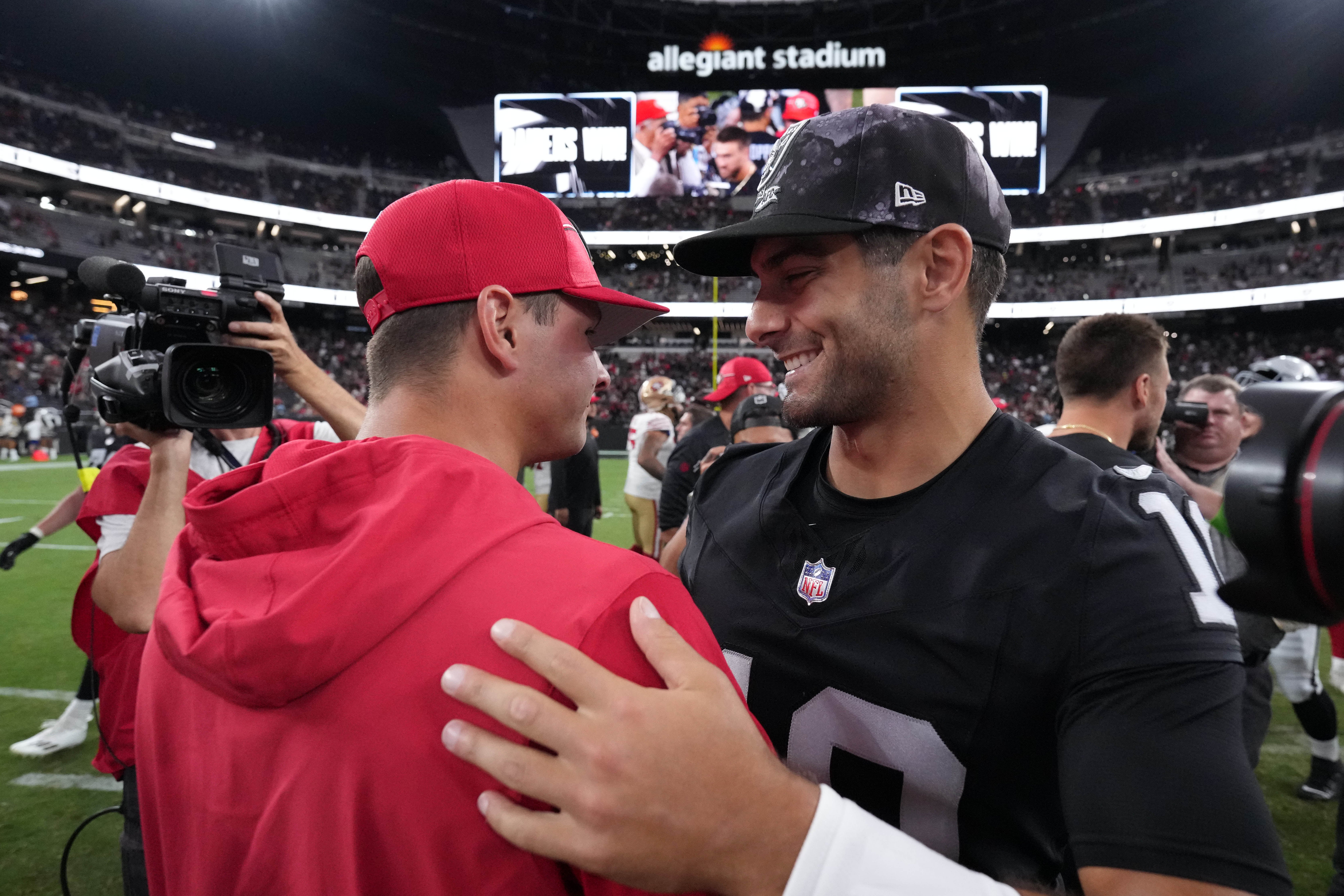Las Vegas Raiders quarterback Jimmy Garoppolo (right) and San Francisco 49ers quarterback Brock Purdy embrace after the game at Allegiant Stadium.
