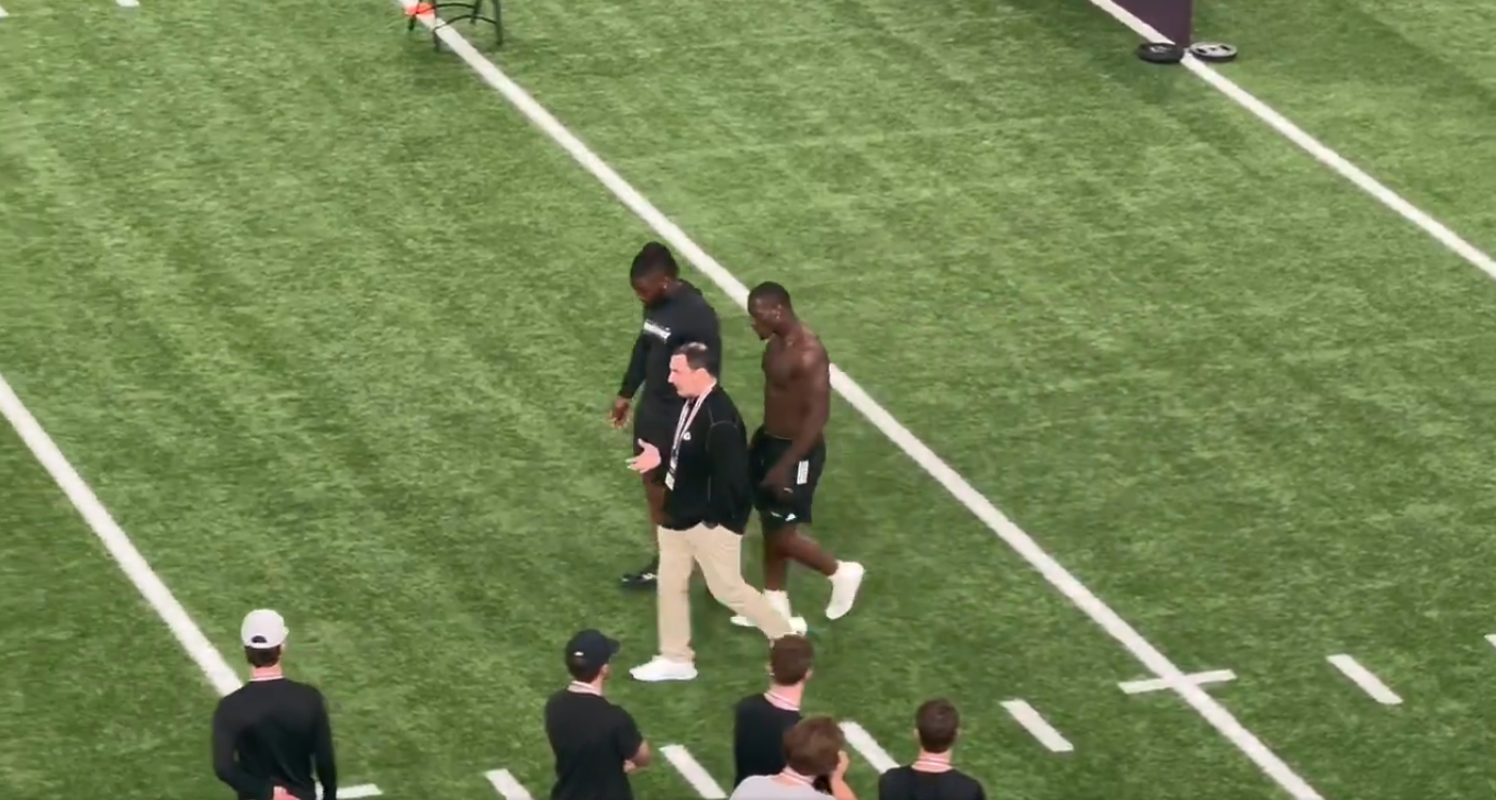 Chiefs DL coach Joe Cullen talks to Aggies DL Nic Scourton and Shemar Turner ahead of Texas A&M Pro Day.