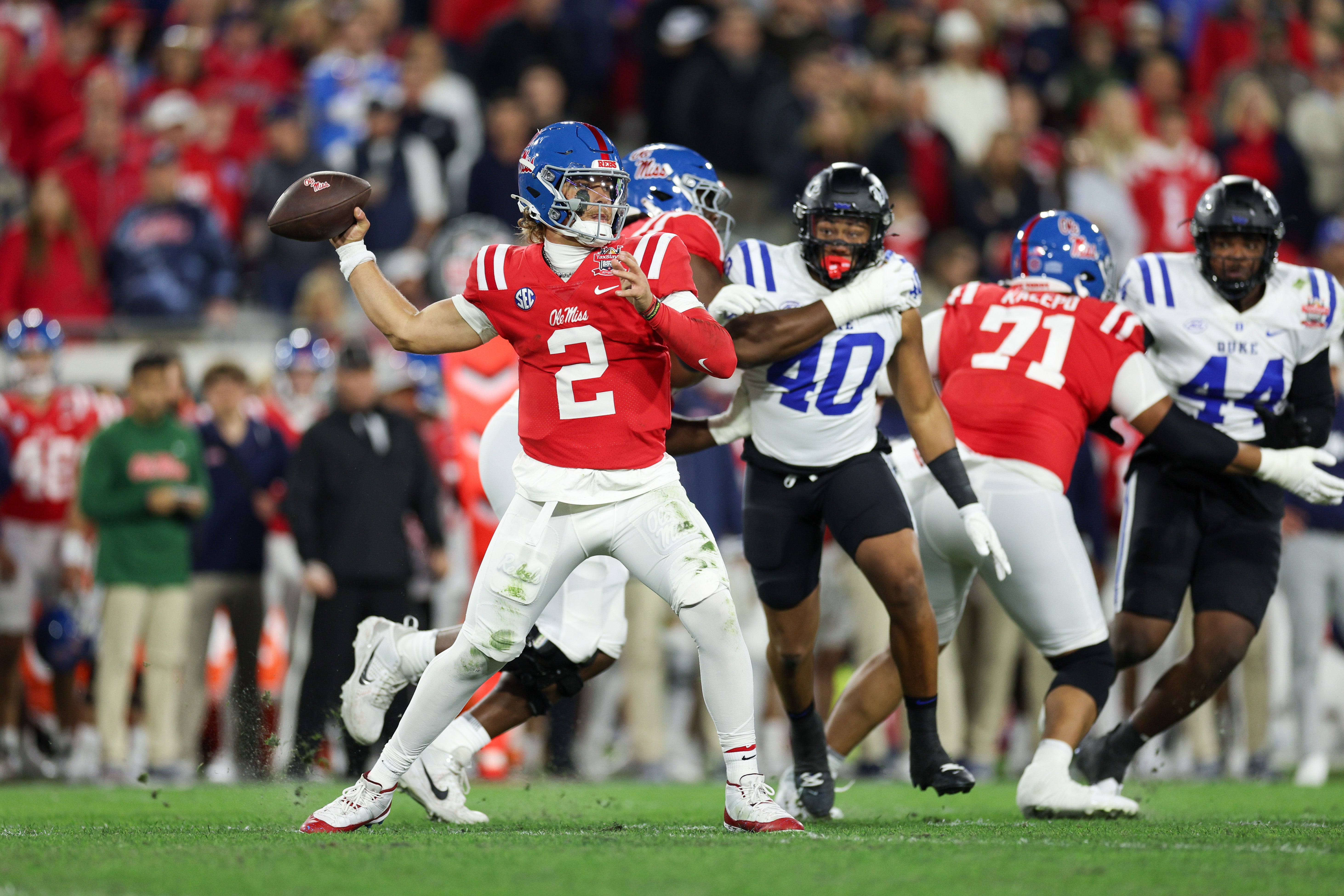 Jan 2, 2025; Jacksonville, FL, USA; Mississippi Rebels quarterback Jaxson Dart (2) drops back to pass against the Duke Blue Devils in the first quarter during the Gator Bowl at EverBank Stadium.