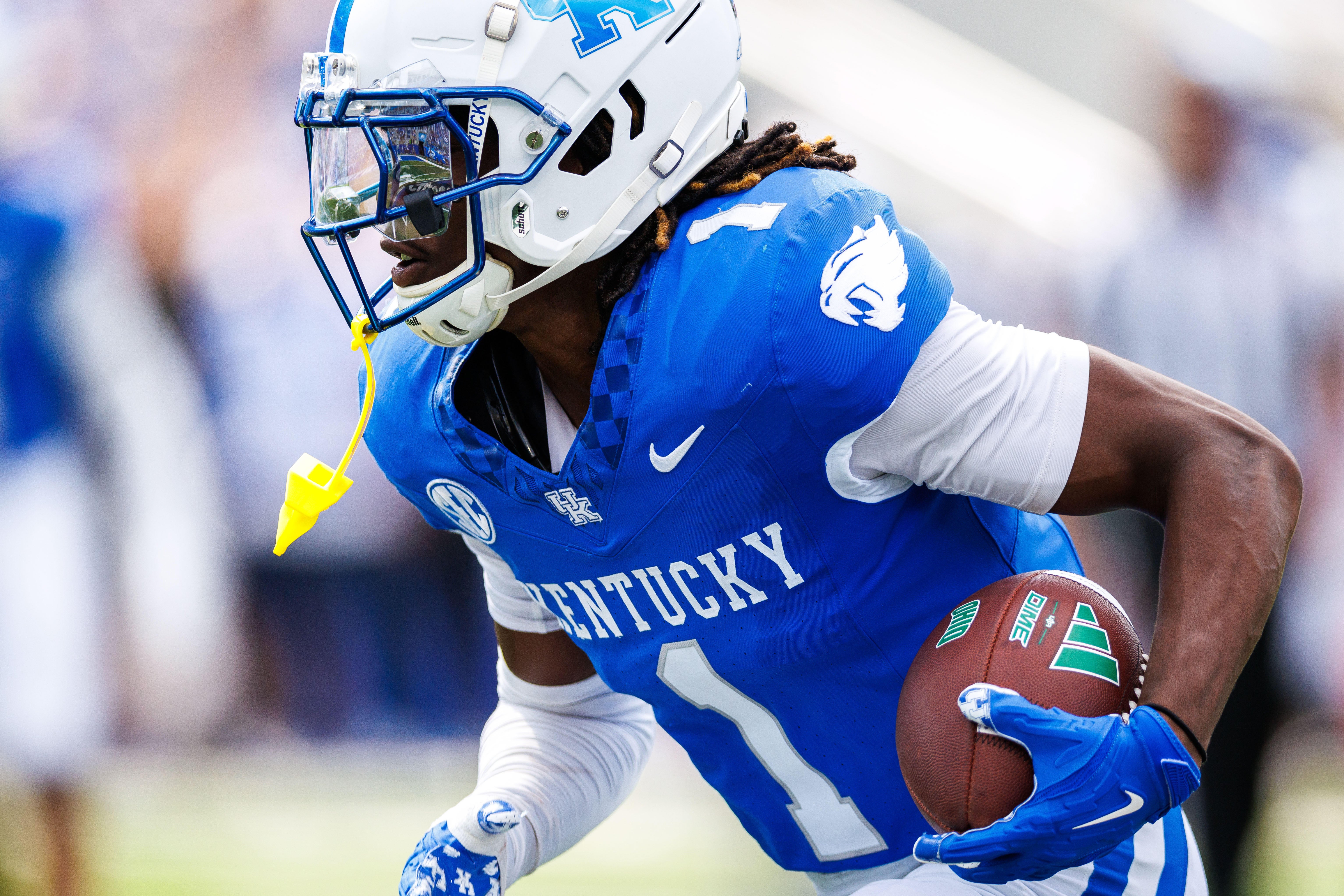 Sep 21, 2024; Lexington, Kentucky, USA; Kentucky Wildcats defensive back Maxwell Hairston (1) intercepts an Ohio Bobcats pass and carries it towards the end zone during the third quarter at Kroger Field.
