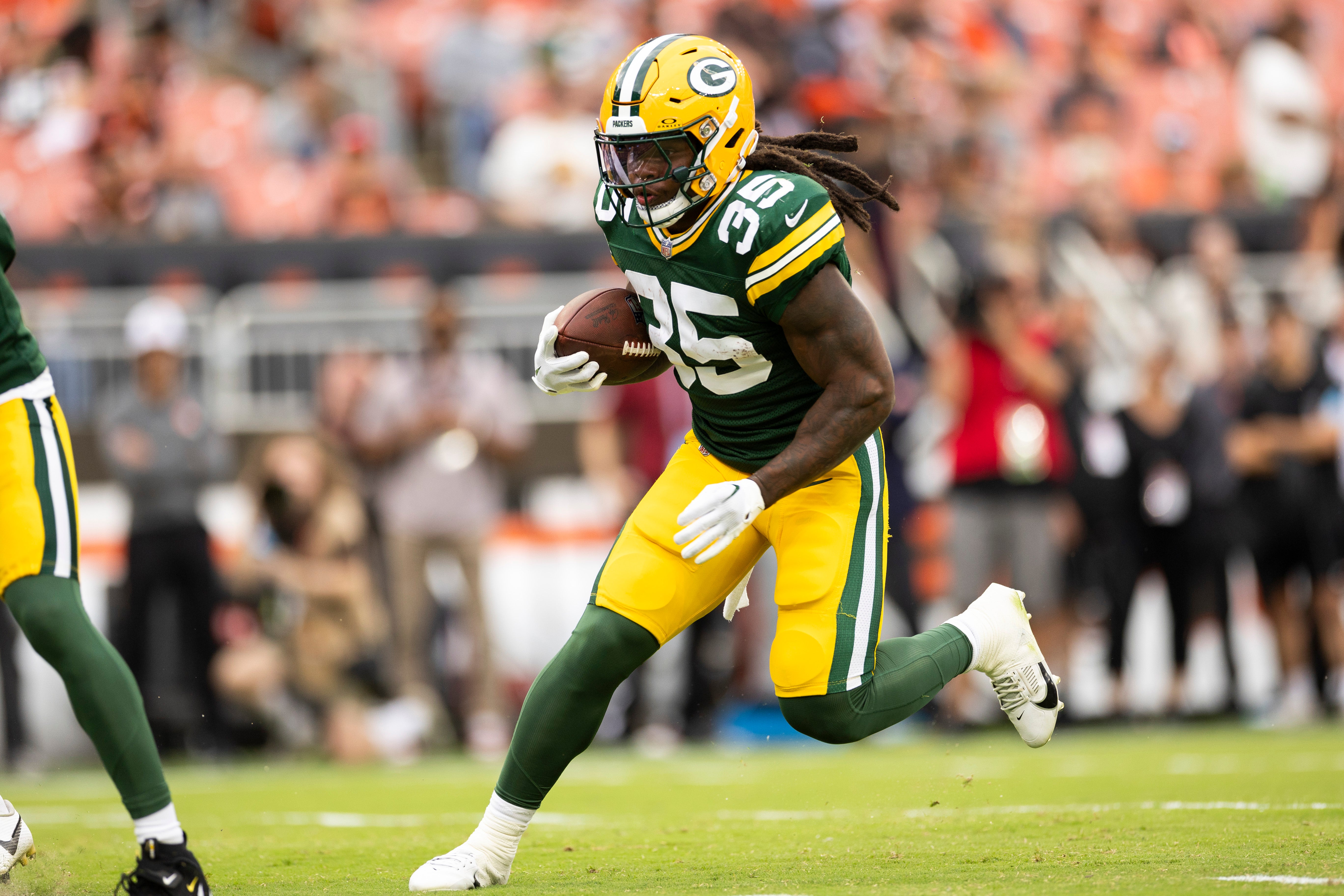 Green Bay Packers running back Jarveon Howard (35) runs the ball against the Cleveland Browns during the fourth quarter at Cleveland Browns Stadium.