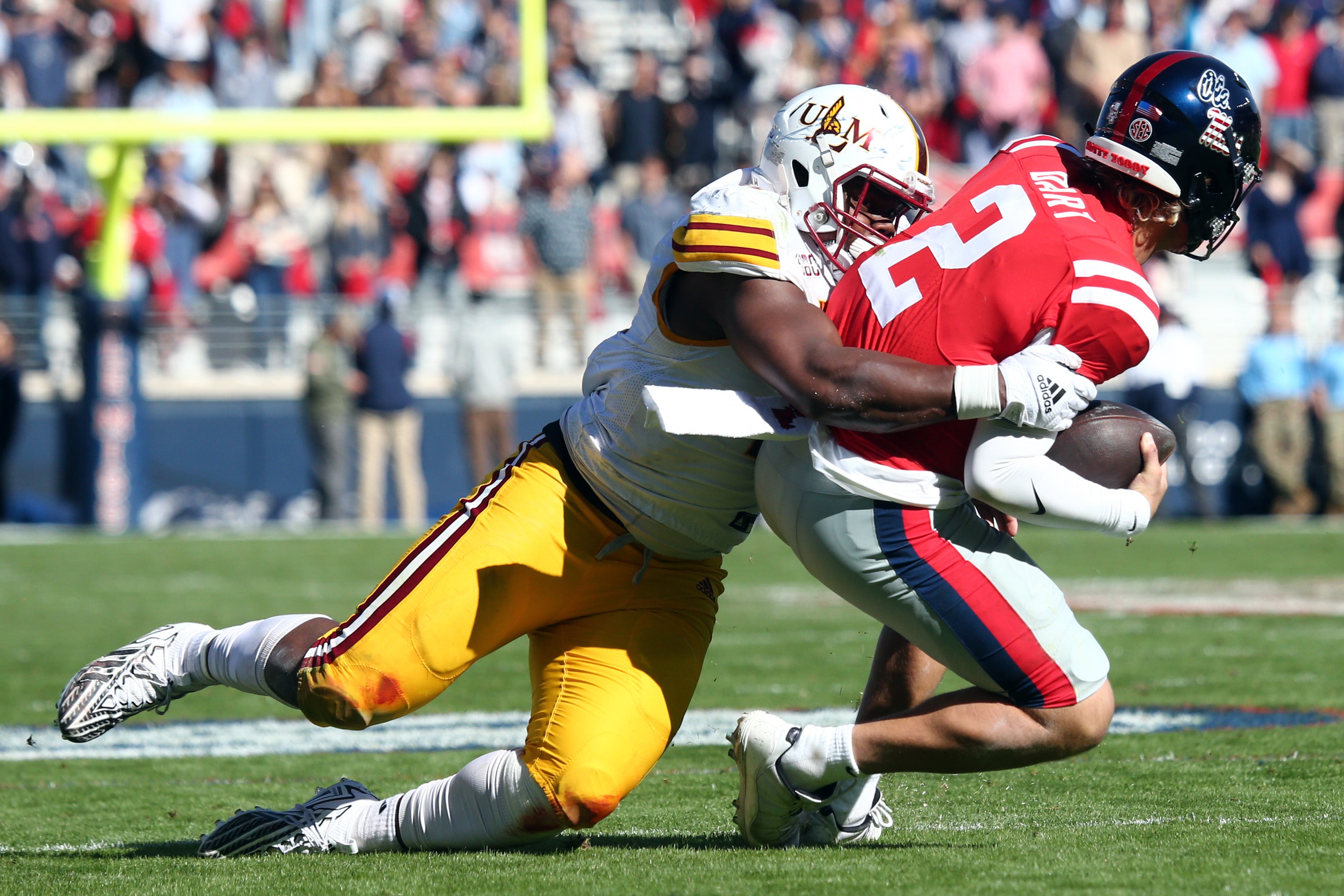 Nov 18, 2023; Oxford, Mississippi, USA; Louisiana Monroe Warhawks defensive linemen Adin Huntington (45) tackles Mississippi Rebels quarterback Jaxson Dart (2) during the first half at Vaught-Hemingway Stadium.