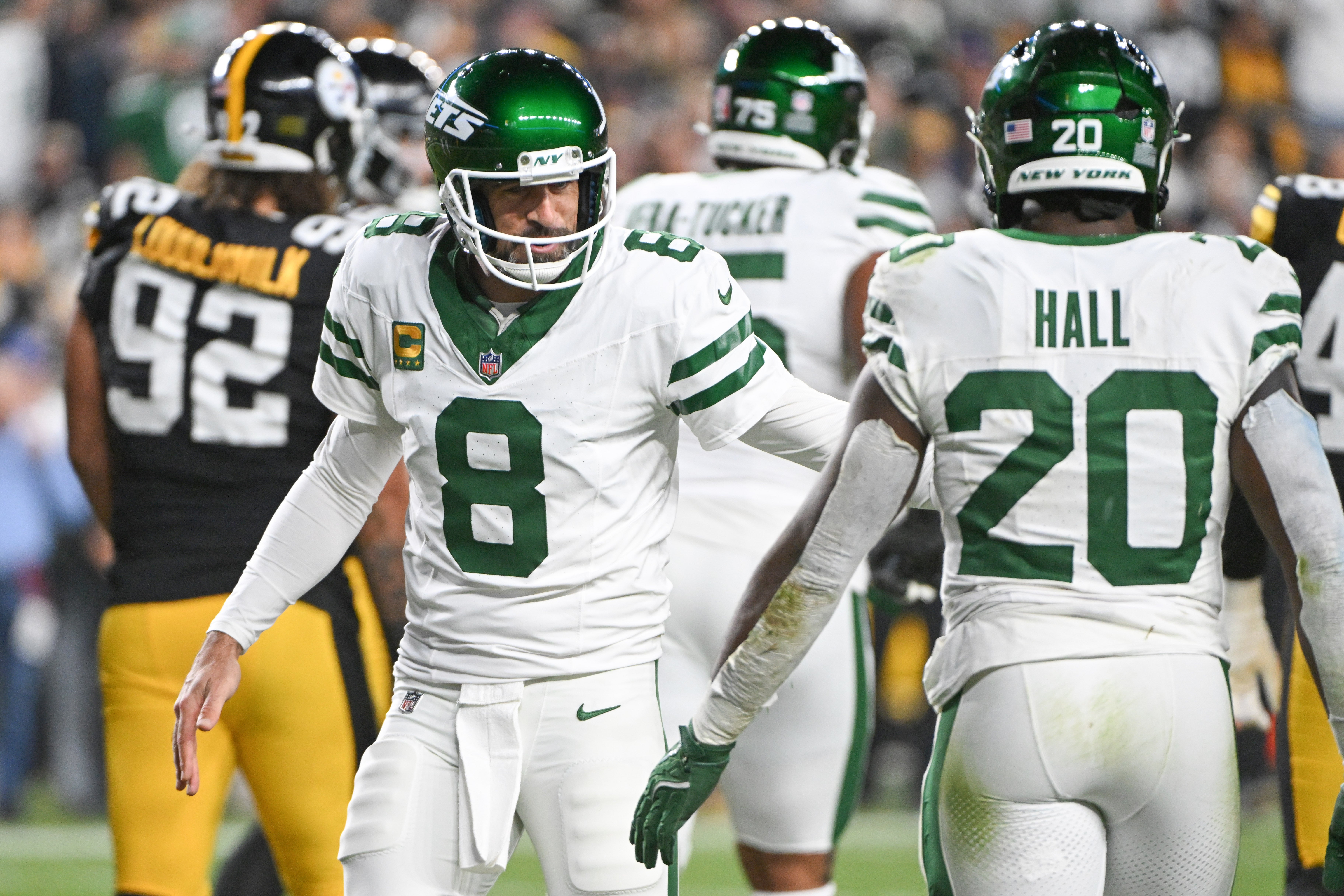 Oct 20, 2024; Pittsburgh, Pennsylvania, USA; New York Jets running back Breece Hall (20) and quarterback Aaron Rodgers (8) celebrate a touchdown agianst the Pittsburgh Steelers during the first quarter at Acrisure Stadium.