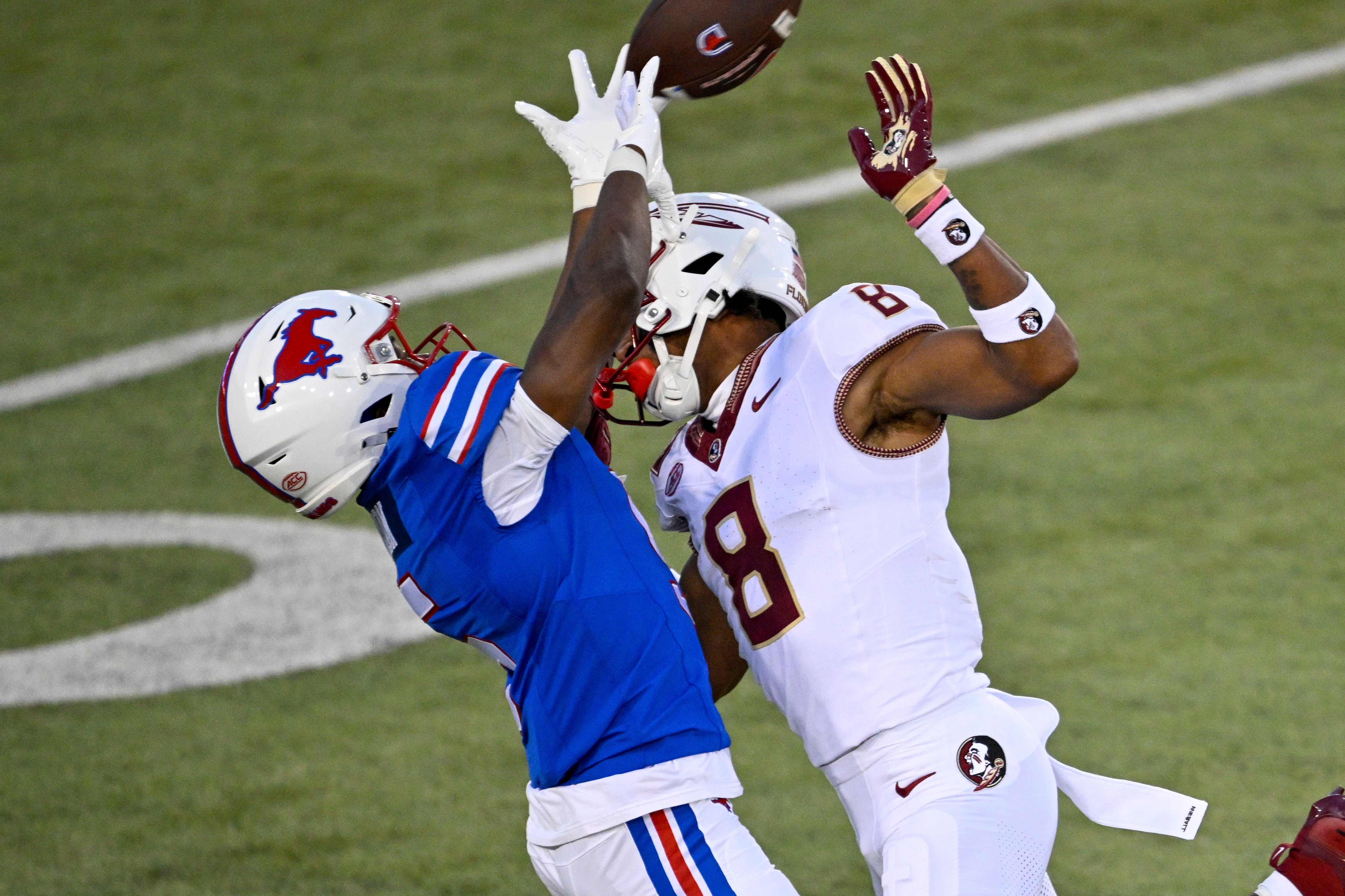 Sep 28, 2024; Dallas, Texas, USA; Florida State Seminoles defensive back Azareye'h Thomas (8) breaks up a pass intended for Southern Methodist Mustangs wide receiver Moochie Dixon (5) during the first quarter at Gerald J. Ford Stadium.