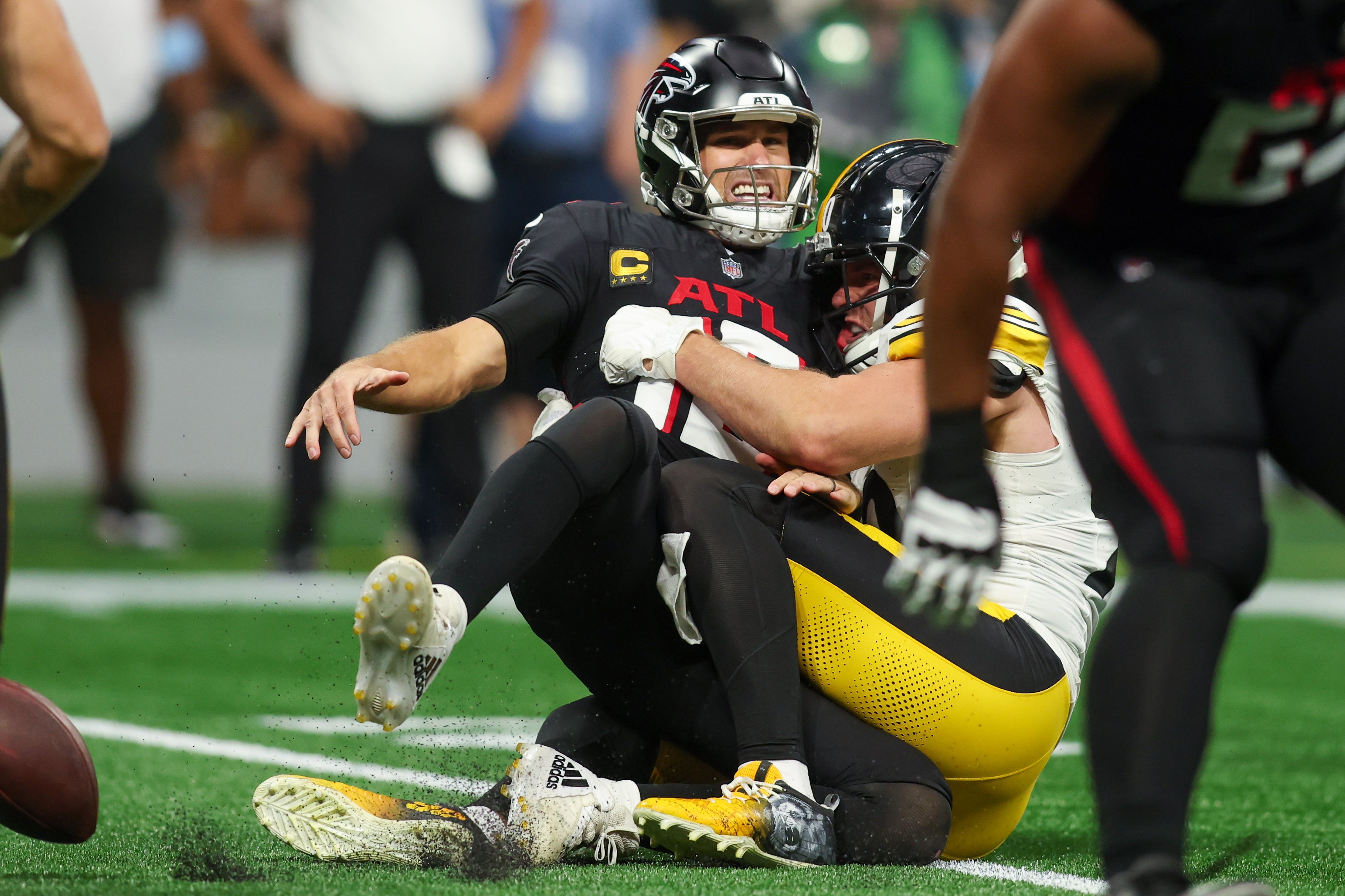 Sep 8, 2024; Atlanta, Georgia, USA; Pittsburgh Steelers linebacker T.J. Watt (90) tackles Atlanta Falcons quarterback Kirk Cousins (18) in the third quarter at Mercedes-Benz Stadium. \