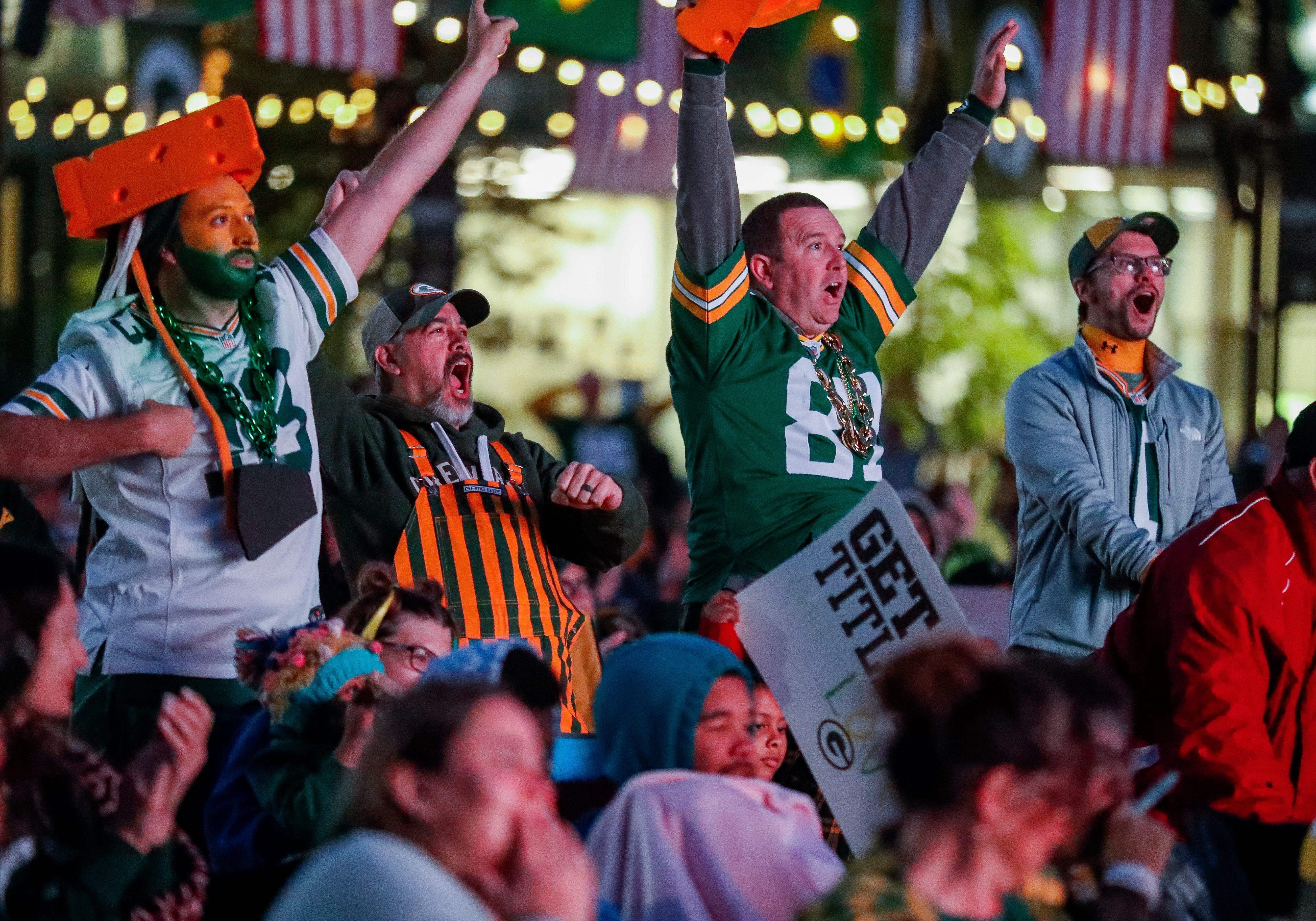Green Bay Packers fans celebrate after a play during a watch party for the Green Bay Packers game against the Philadelphia Eagles in Sao Paulo, Brazil, on Friday, September 6, 2024, at Titletown in Ashwaubenon, Wis.