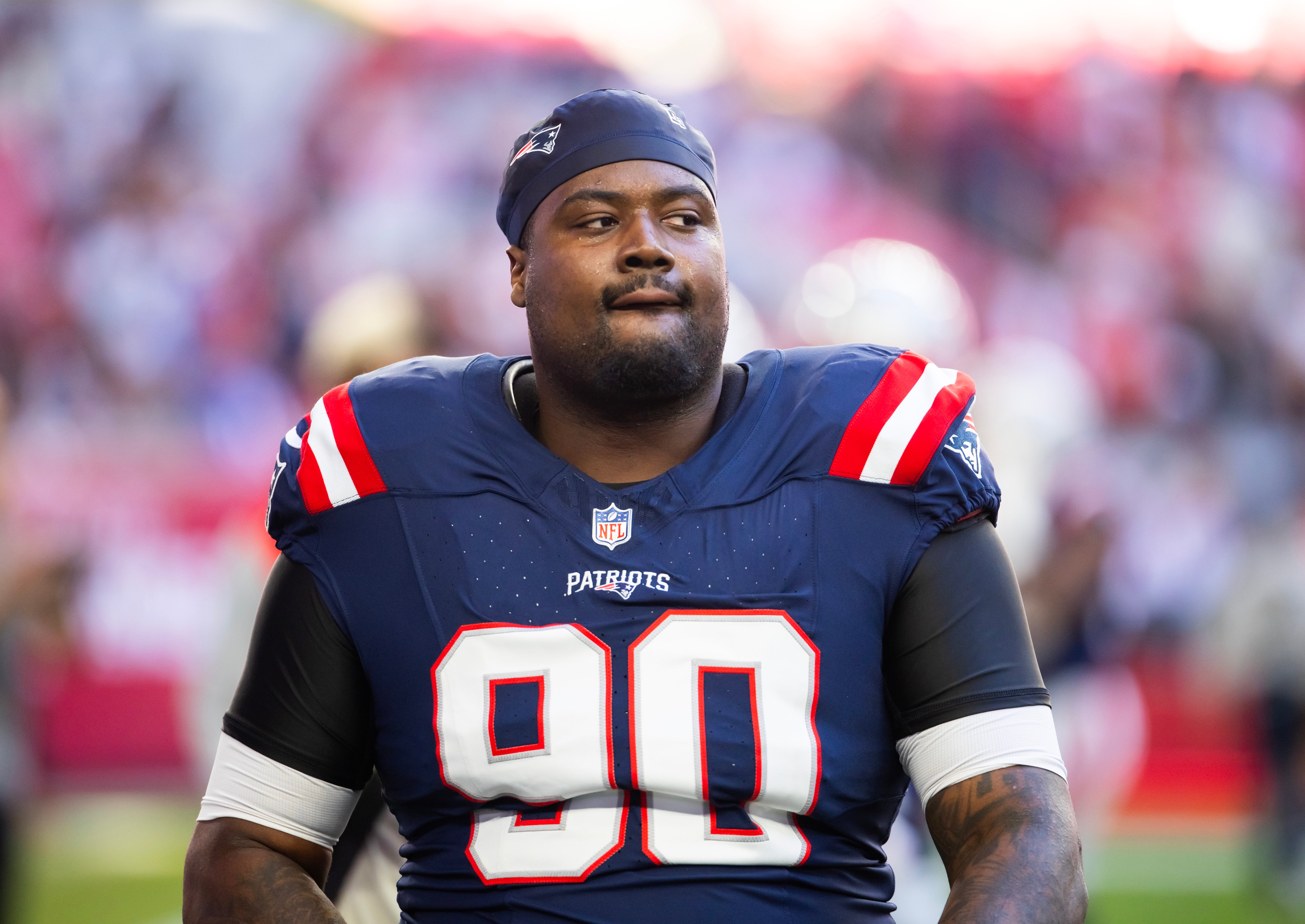 Dec 15, 2024; Glendale, Arizona, USA; New England Patriots defensive tackle Christian Barmore (90) against the Arizona Cardinals at State Farm Stadium.