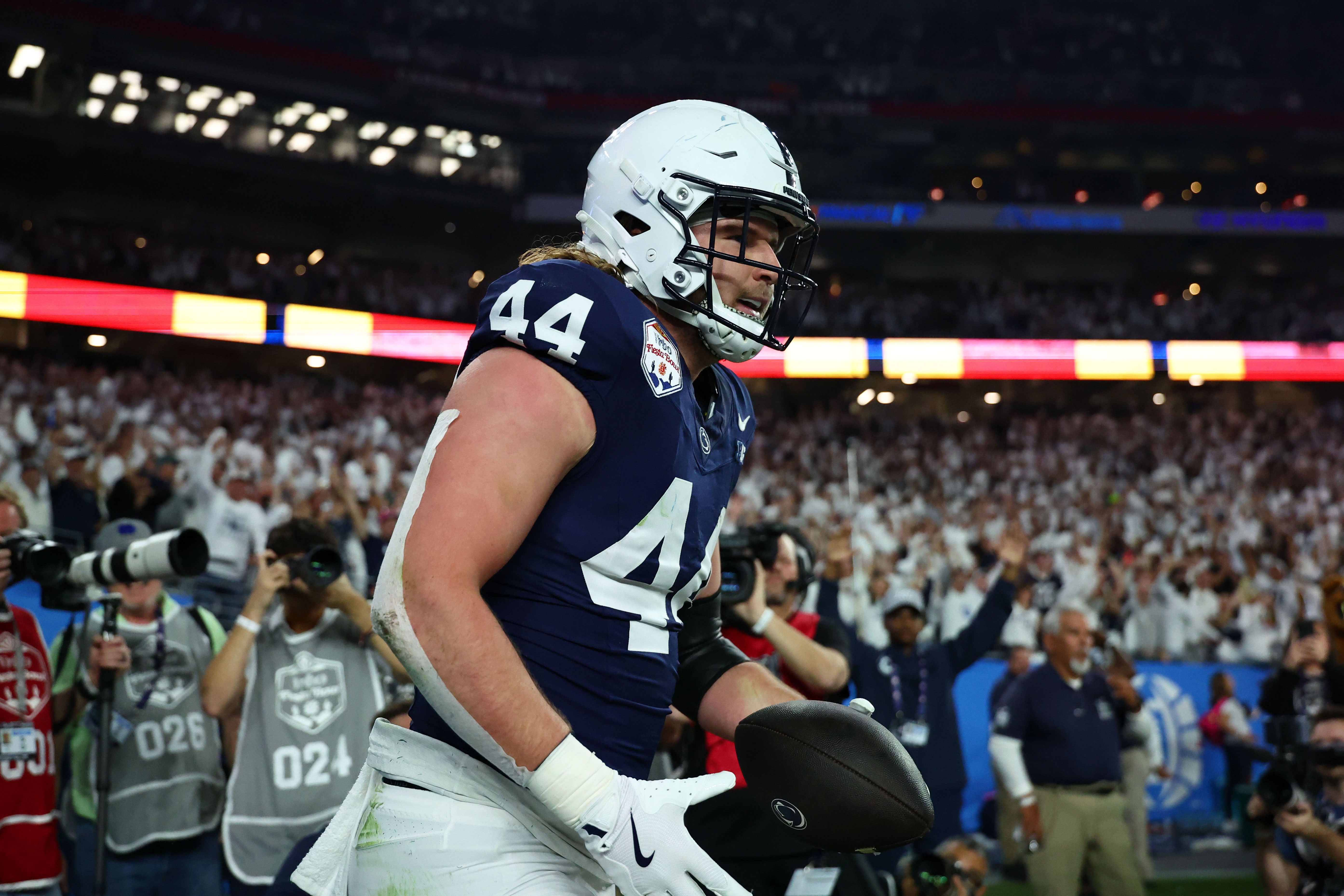 Dec 31, 2024; Glendale, AZ, USA; Penn State Nittany Lions tight end Tyler Warren (44) reacts after scoring a touchdown against the Boise State Broncos during the first half in the Fiesta Bowl at State Farm Stadium.