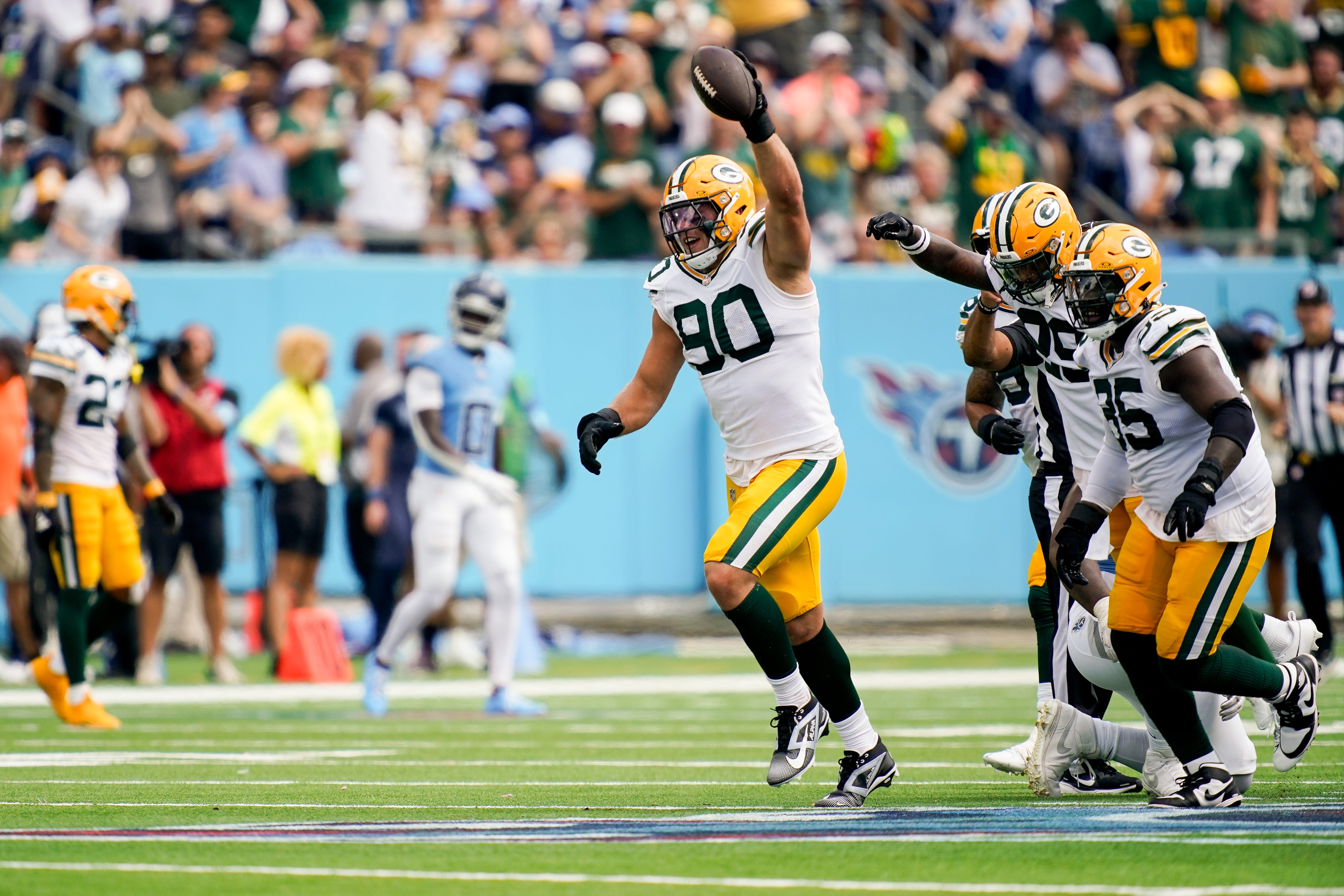 Green Bay Packers defensive end Lukas Van Ness (90) celebrates after recovering a ball fumbled by Tennessee Titans quarterback Will Levis during the third quarter at Nissan Stadium in Nashville, Tenn., Sunday, Sept. 22, 2024.