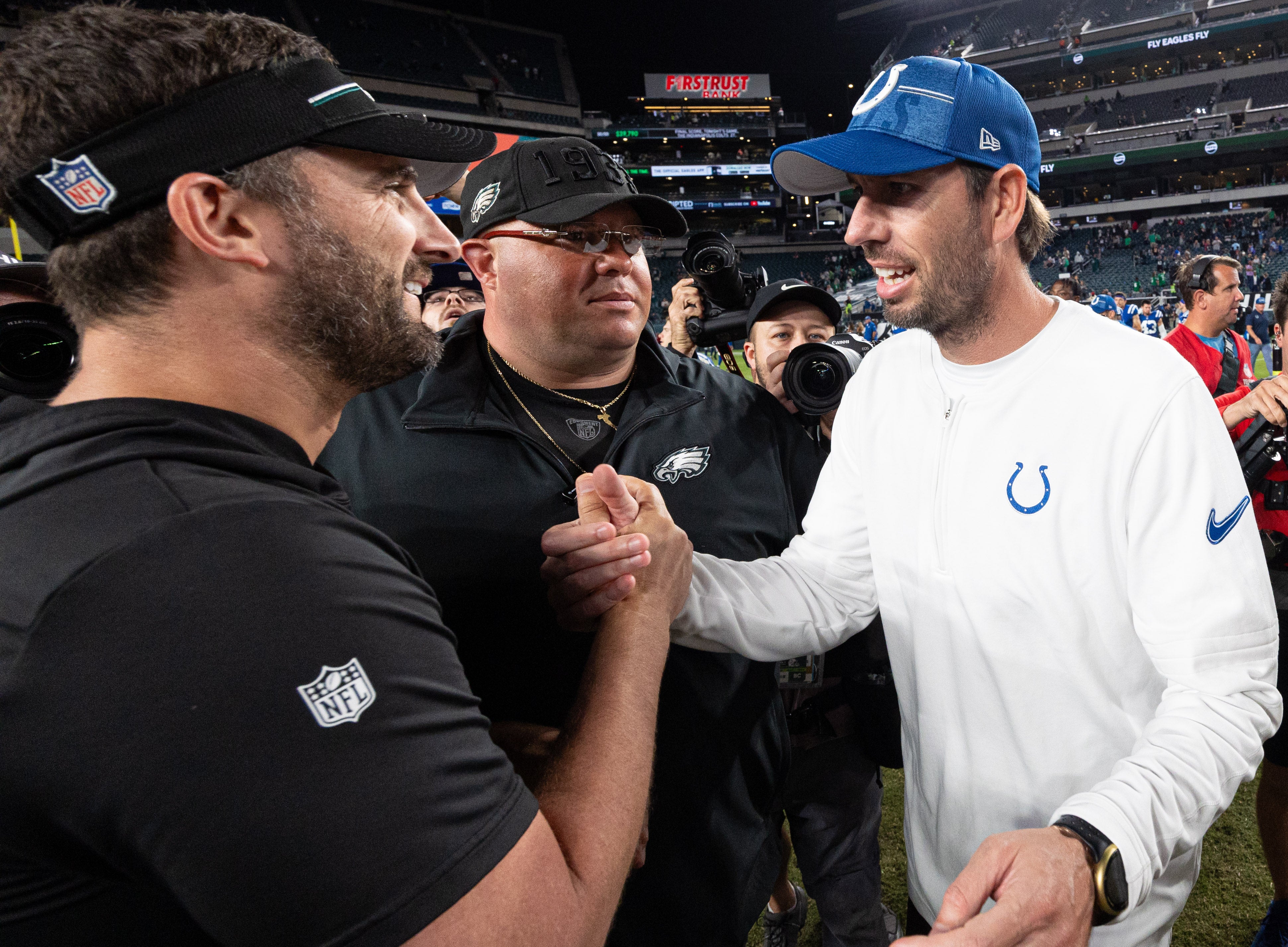 Philadelphia Eagles head coach Nick Sirianni (L) shakes hands with Indianapolis Colts head coach Shane Steichen (R) after a game at Lincoln Financial Field.
