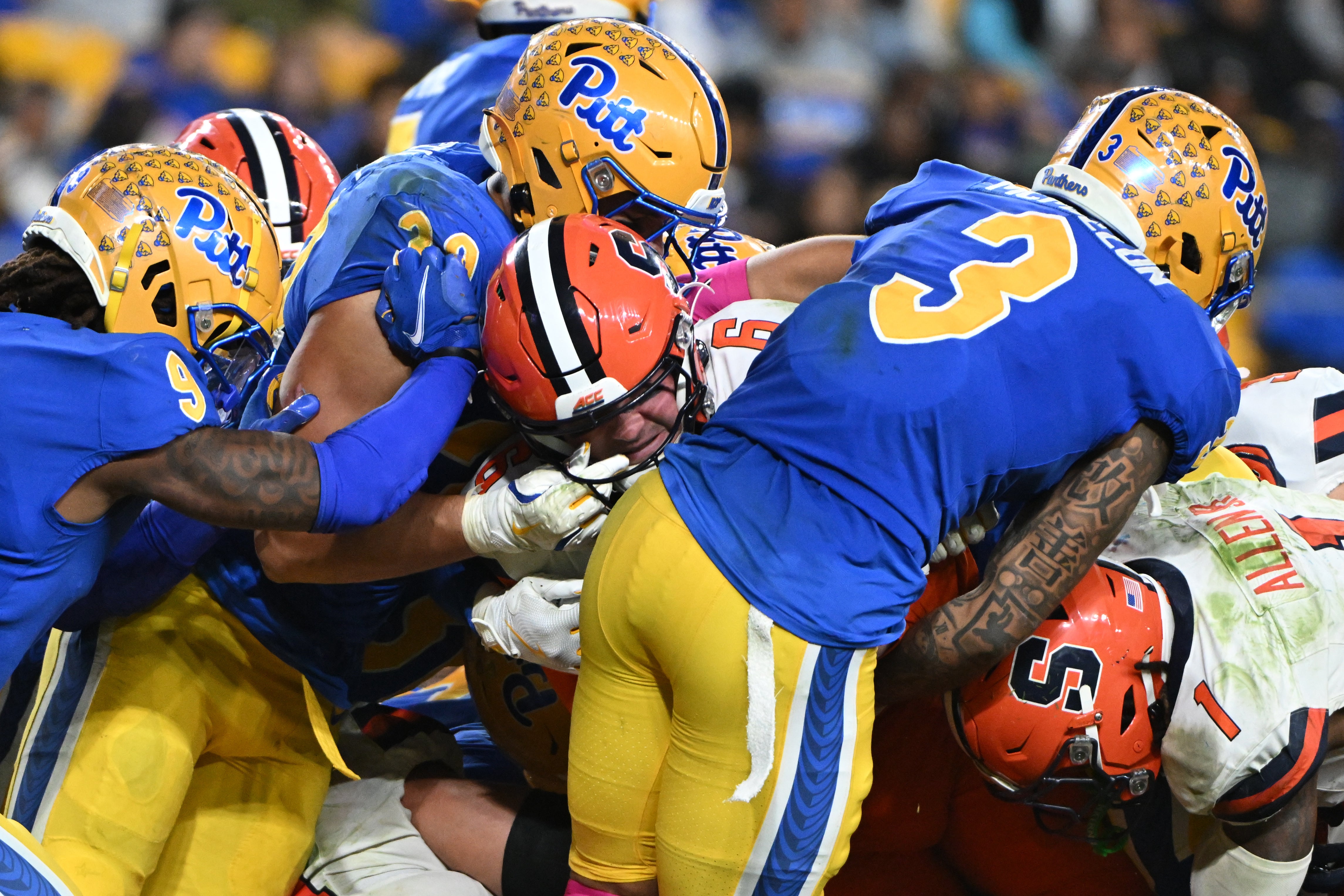 Oct 24, 2024; Pittsburgh, Pennsylvania, USA; Syracuse Orange quarterback Kyle McCord (6) scores a touchdown against Pittsburgh Panthers linebacker Brandon George (30) during the third quarter at Acrisure Stadium.