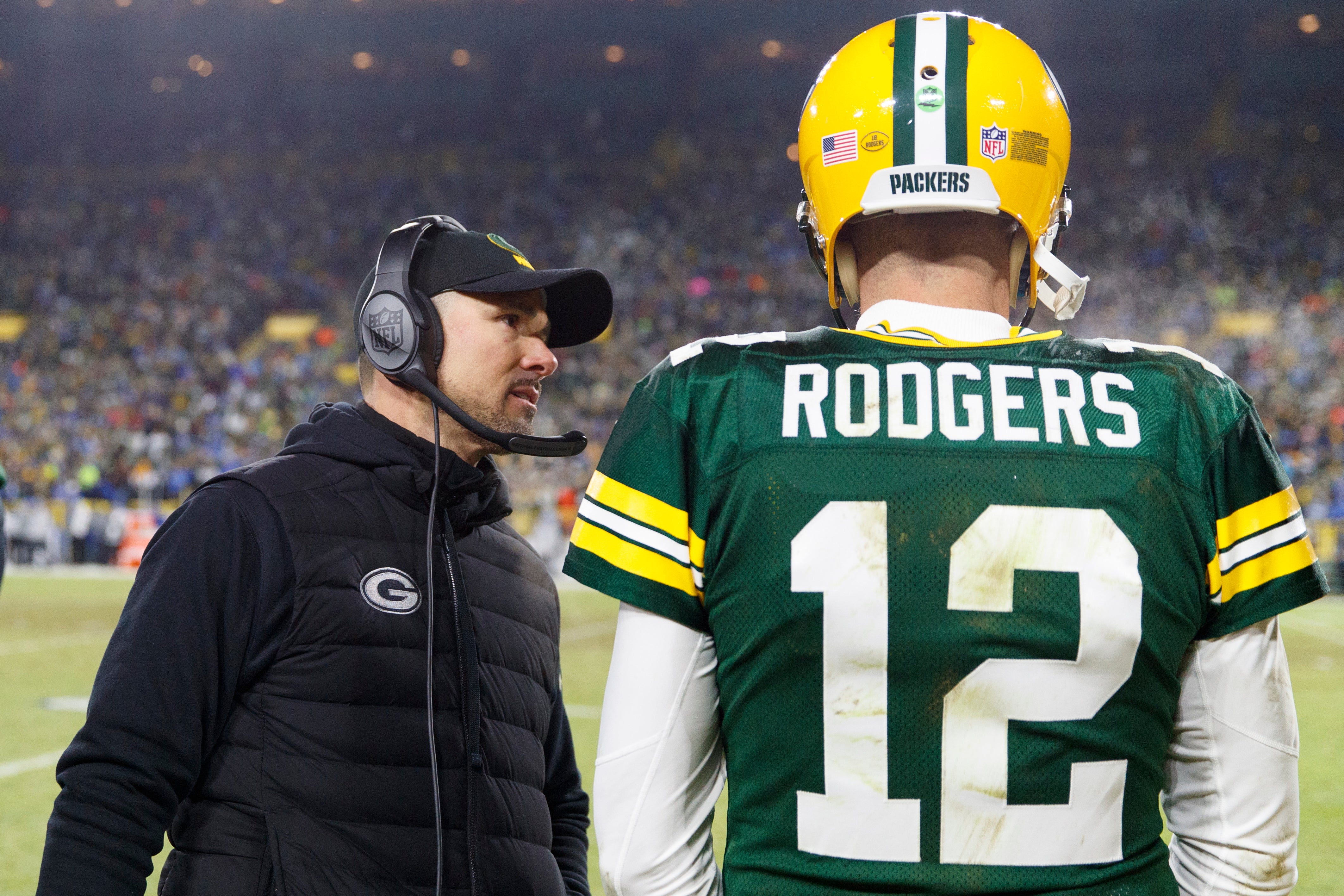 Green Bay Packers head coach Matt LaFleur talks with quarterback Aaron Rodgers (12) during the fourth quarter against the Detroit Lions at Lambeau Field.