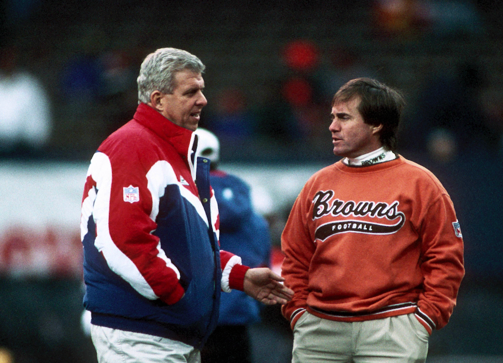 Jan 1, 1995; Cleveland, OH, USA; FILE PHOTO; New England Patriots head coach Bill Parcells talks with Cleveland Browns head coach Bill Belichick prior to the 1994 Wild Card Playoff Game against the Cleveland Browns at Cleveland Stadium.