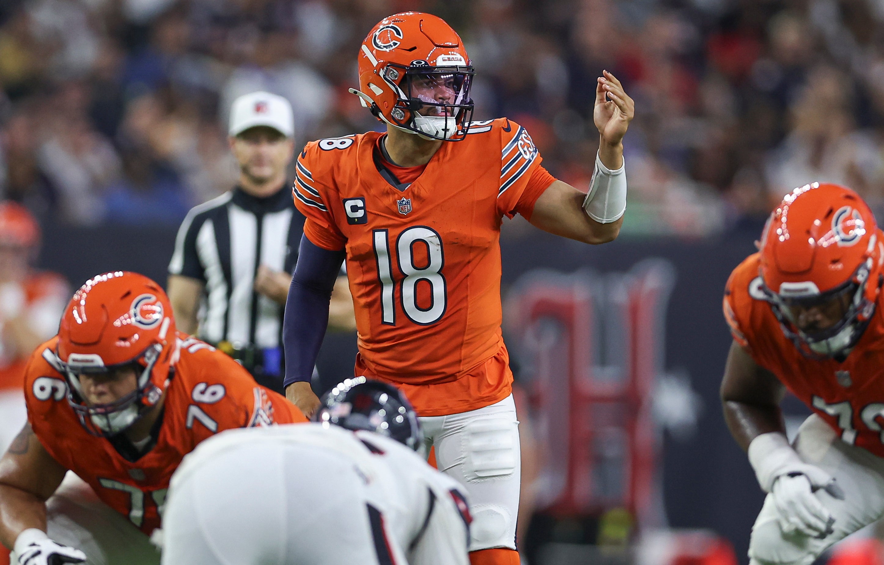 Sep 15, 2024; Houston, Texas, USA; Chicago Bears quarterback Caleb Williams (18) at the line of scrimmage during the game against the Houston Texans at NRG Stadium.