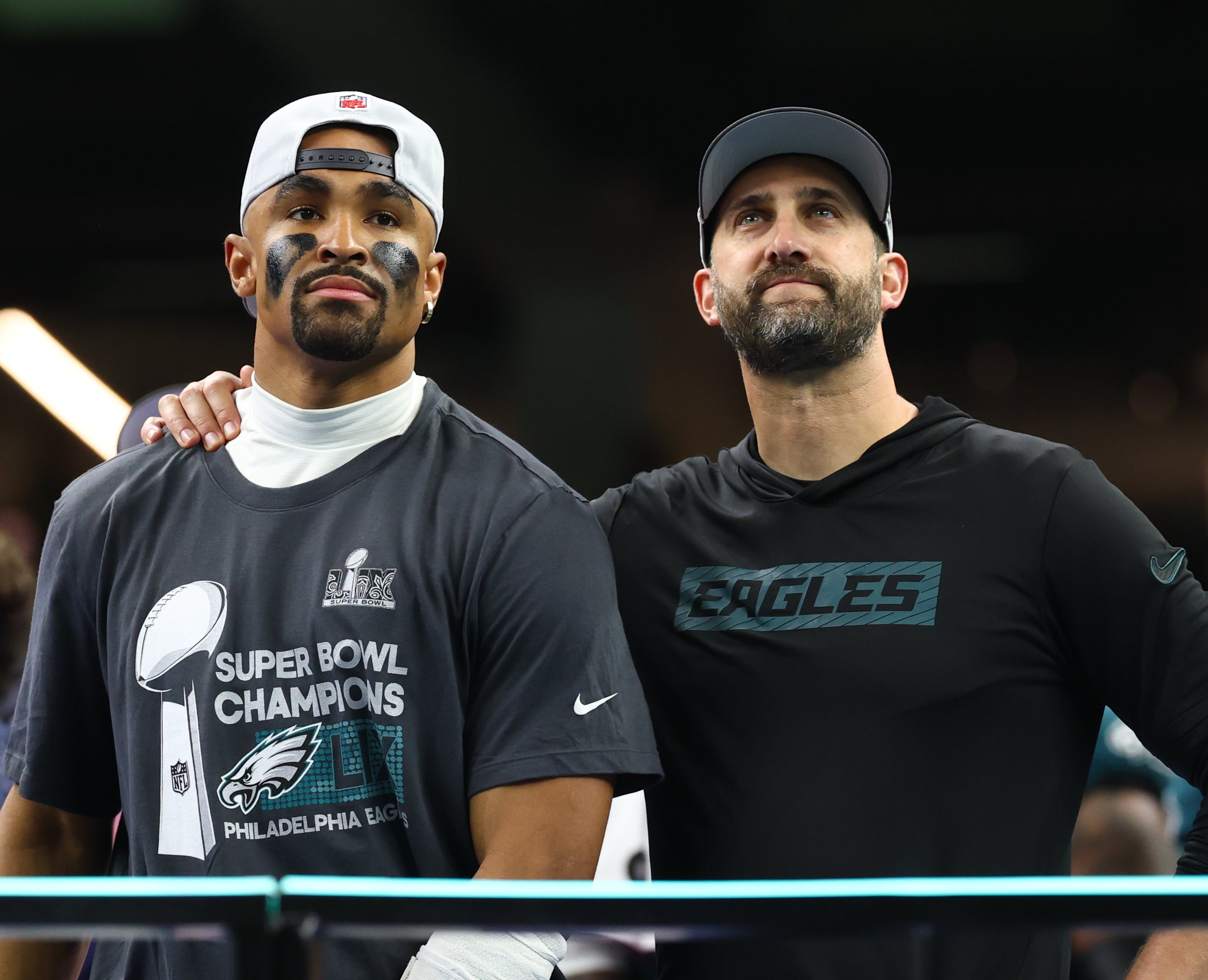 Philadelphia Eagles head coach Nick Sirianni and Philadelphia Eagles quarterback Jalen Hurts (1) on the podium after defeating the Kansas City Chiefs in Super Bowl LIX at Ceasars Superdome.