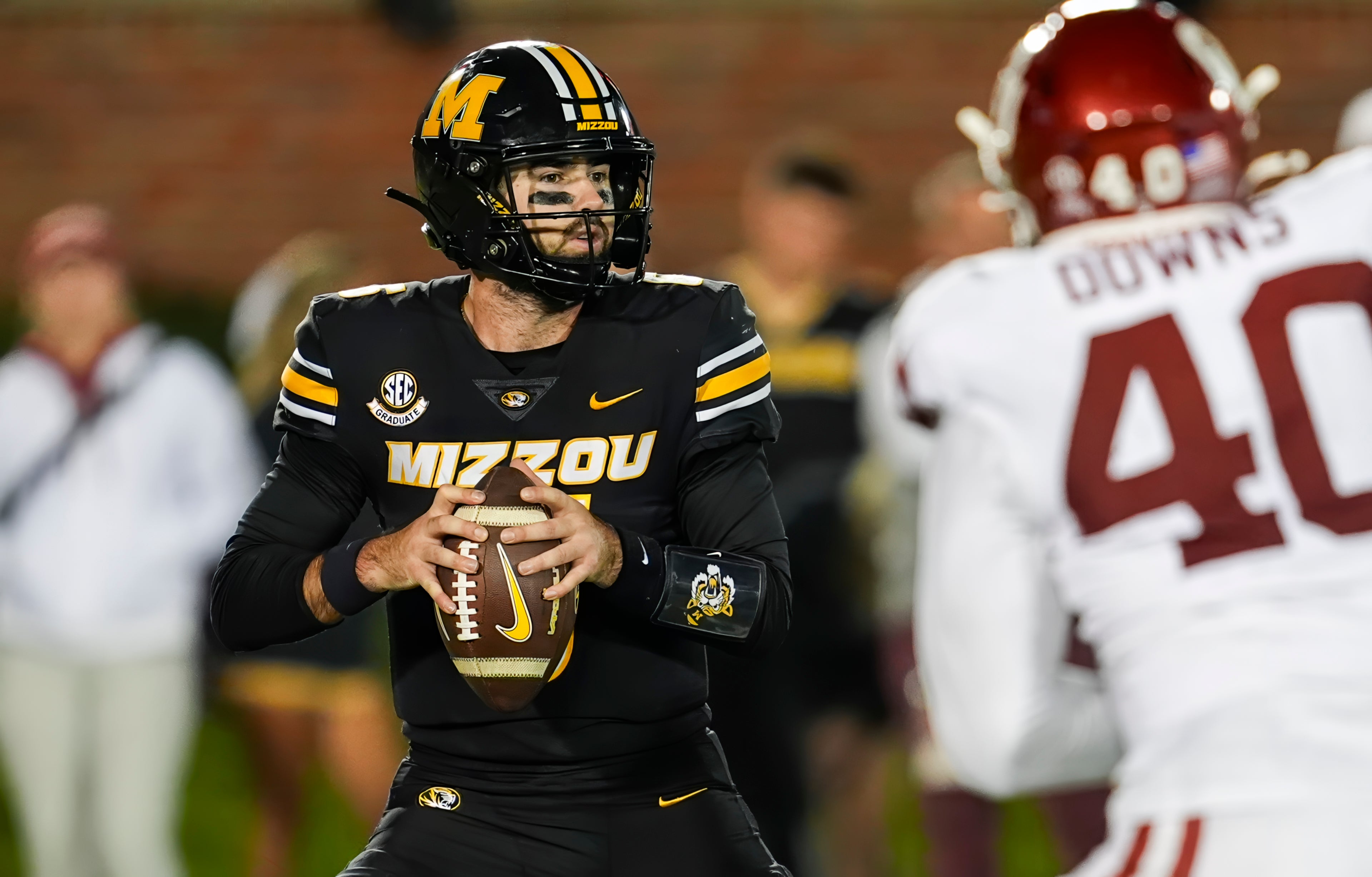 Nov 9, 2024; Columbia, Missouri, USA; Missouri Tigers quarterback Drew Pyne (6) drops back to pass during the second half against the Oklahoma Sooners at Faurot Field at Memorial Stadium. Mandatory Credit: Jay Biggerstaff-Imagn Images