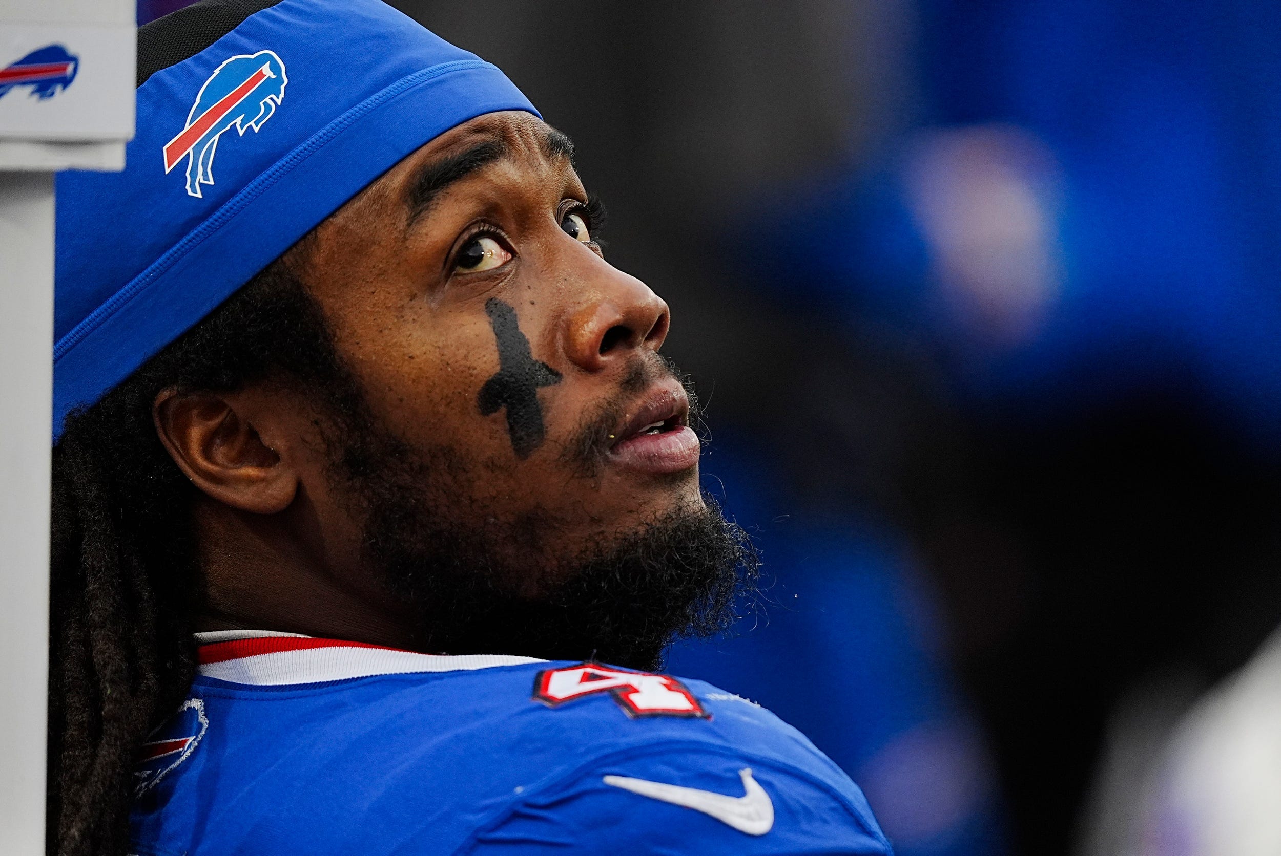 Buffalo Bills running back James Cook (4) takes a breather while the defensive line is on the field during second half of the Bills home game against the New York Jets at Highmark Stadium in Orchard Park on Dec. 29, 2024.