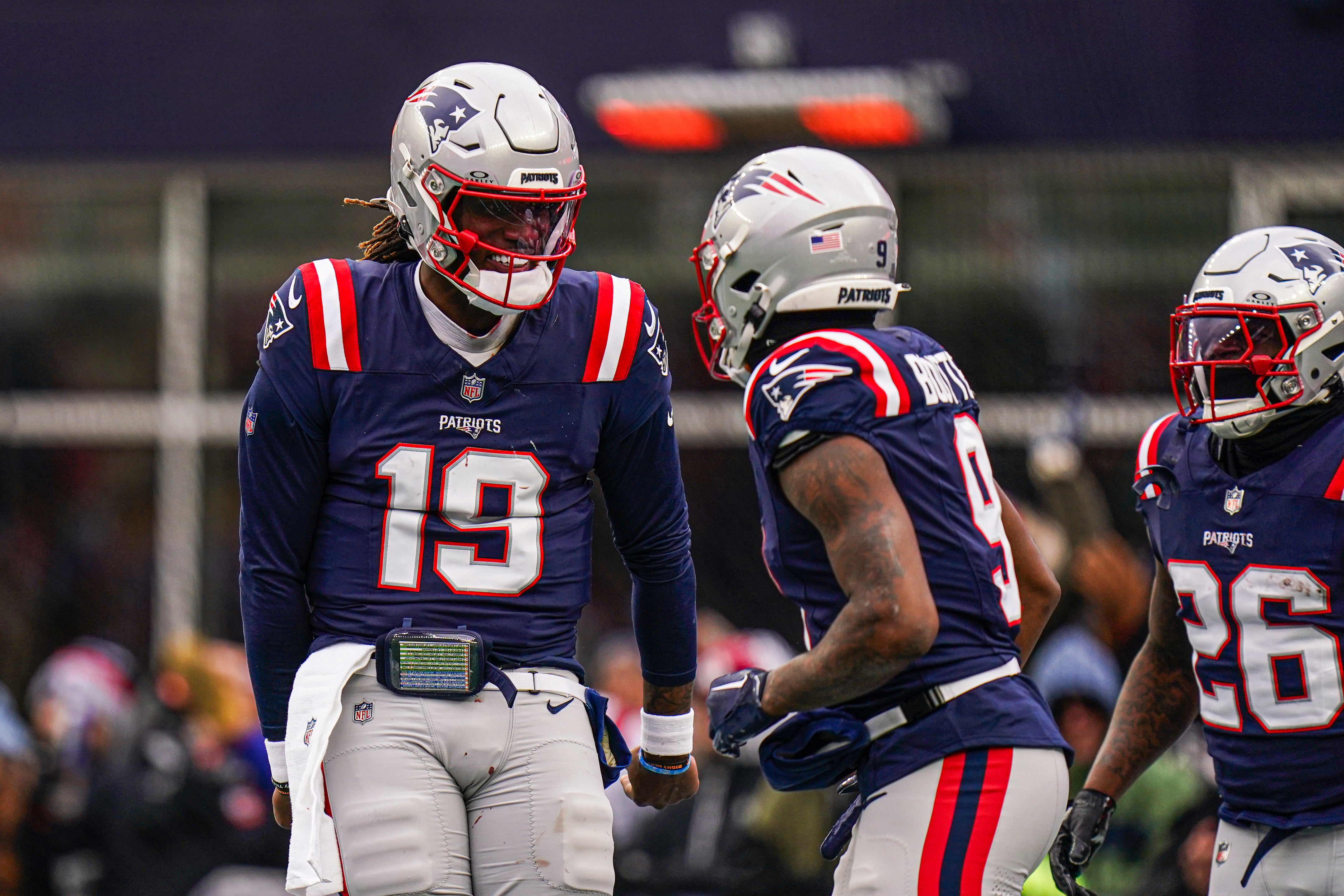 New England Patriots quarterback Joe Milton III (19) reacts after his touchdown pass against the Buffalo Bills in the first half at Gillette Stadium.