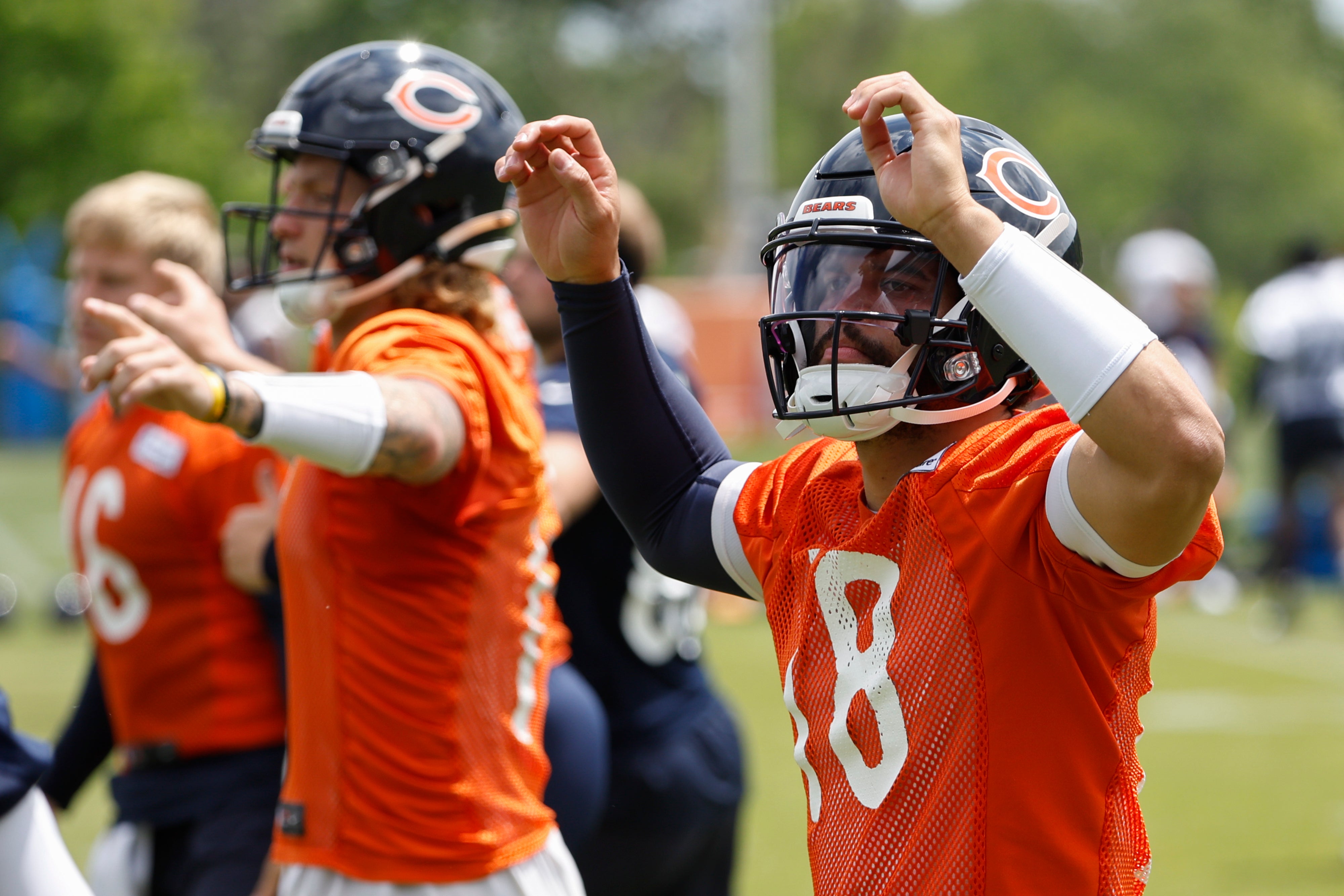 Jun 5, 2024; Lake Forest, IL, USA; Chicago Bears quarterback Caleb Williams (18) warms up during the team's minicamp at Halas Hall.