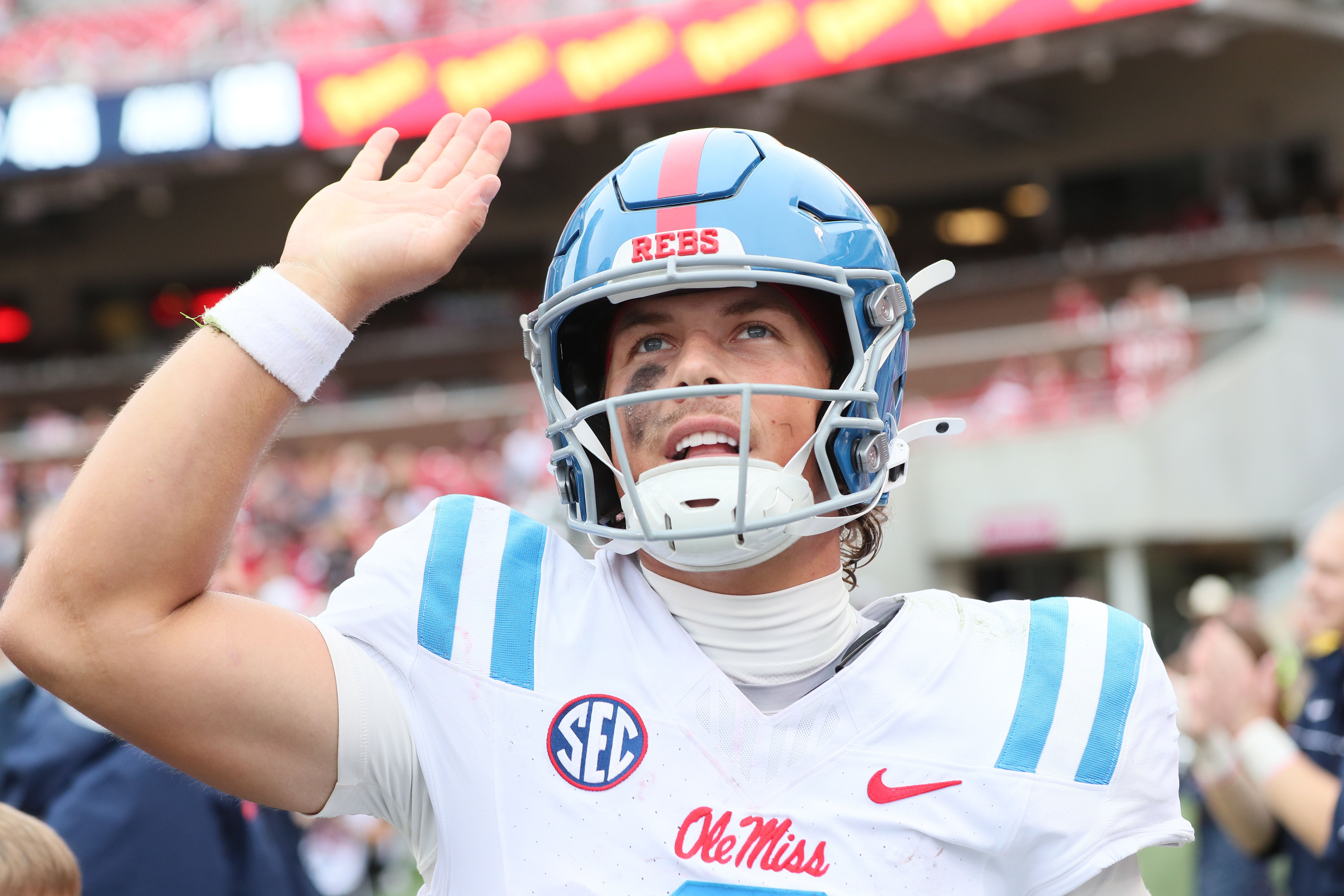 Ole Miss Rebels quarterback Jaxson Dart celebrates after a touchdown in the third quarter against the Arkansas Razorbacks at Donald W. Reynolds Razorback Stadium. Mississippi won 63-31.