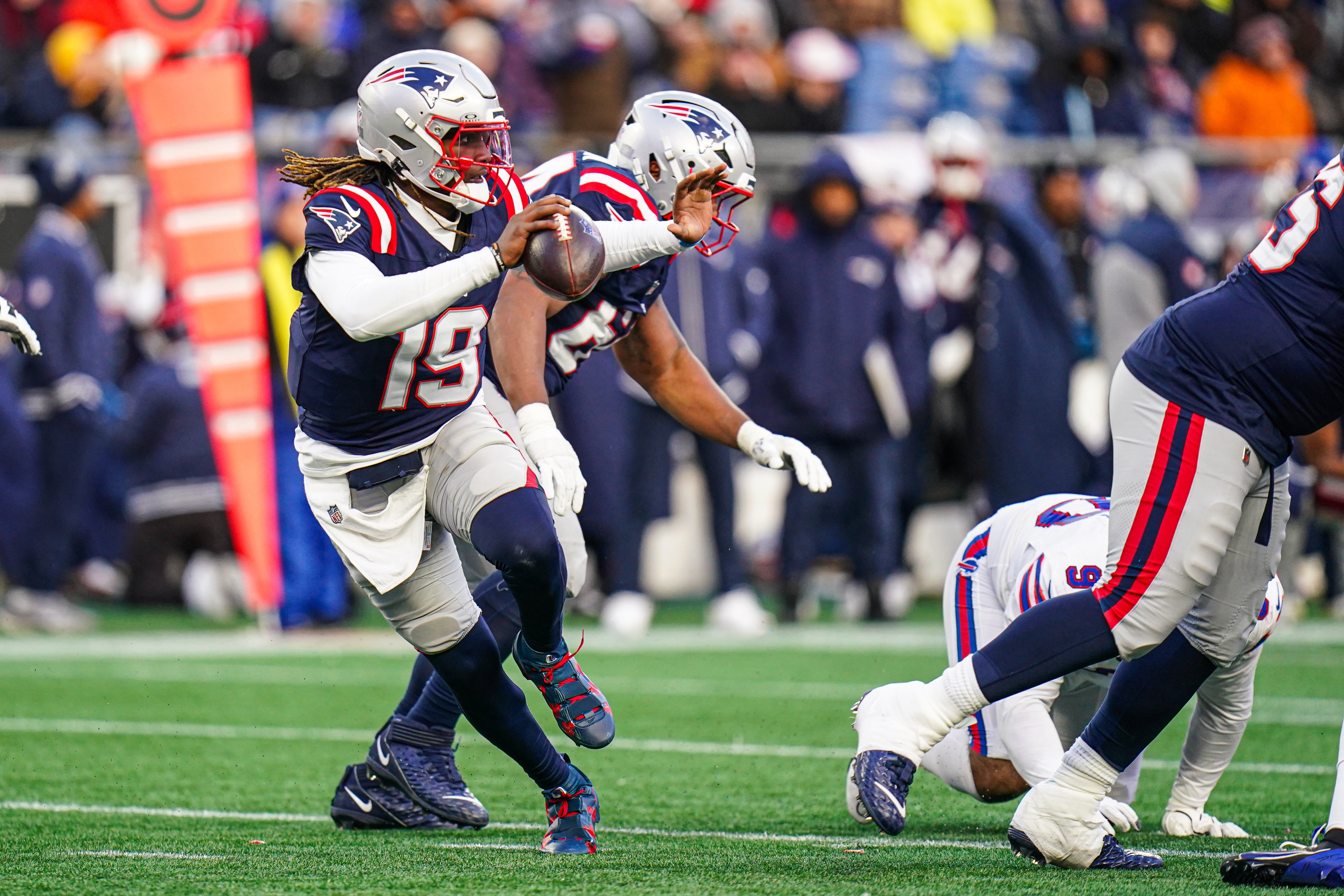 New England Patriots quarterback Joe Milton III (19) looks to pass the ball against the Buffalo Bills in the second half at Gillette Stadium.