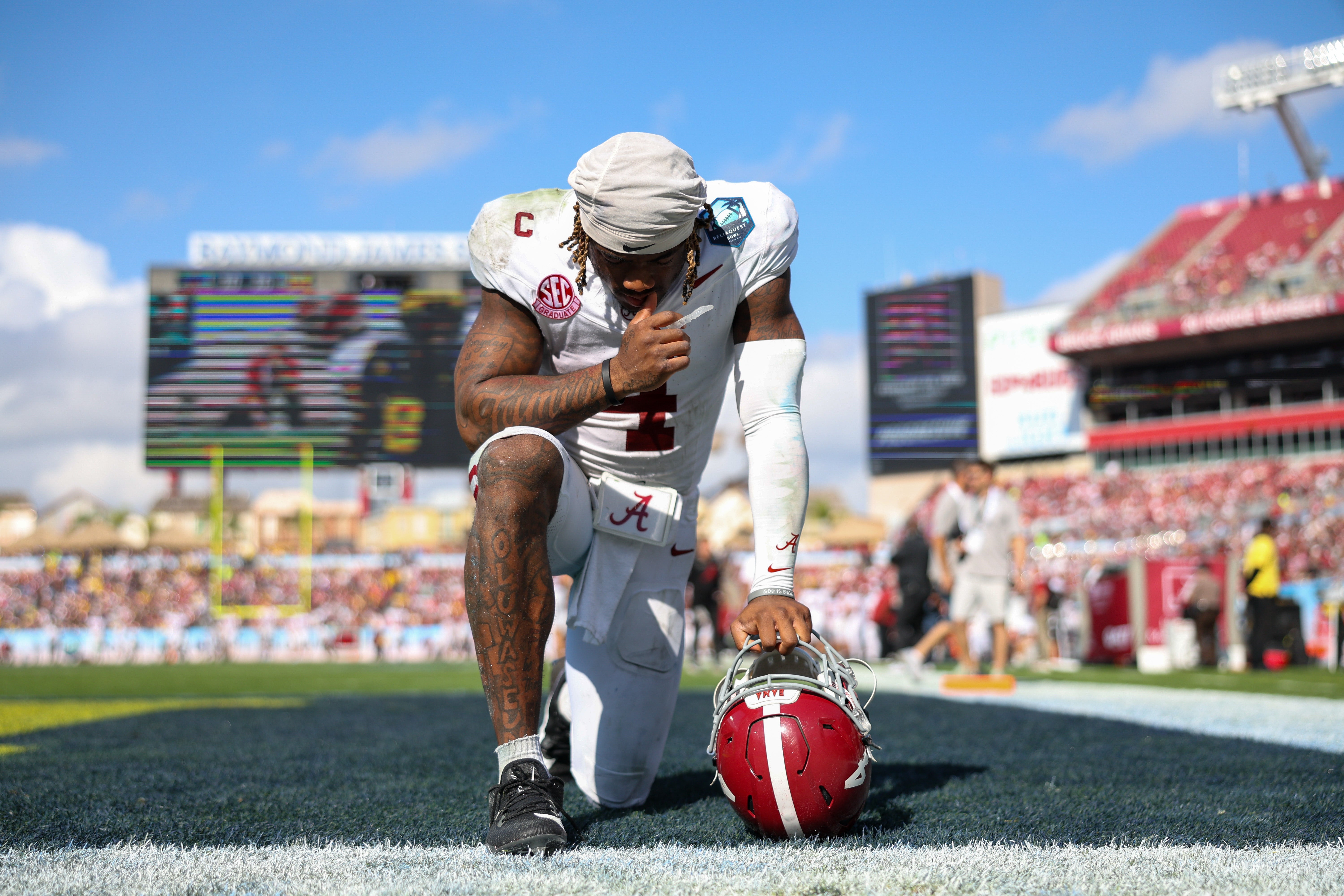 Dec 31, 2024; Tampa, FL, USA; Alabama Crimson Tide quarterback Jalen Milroe (4) gets ready to play the third quarter against the Michigan Wolverines during the ReliaQuest Bowl at Raymond James Stadium.
