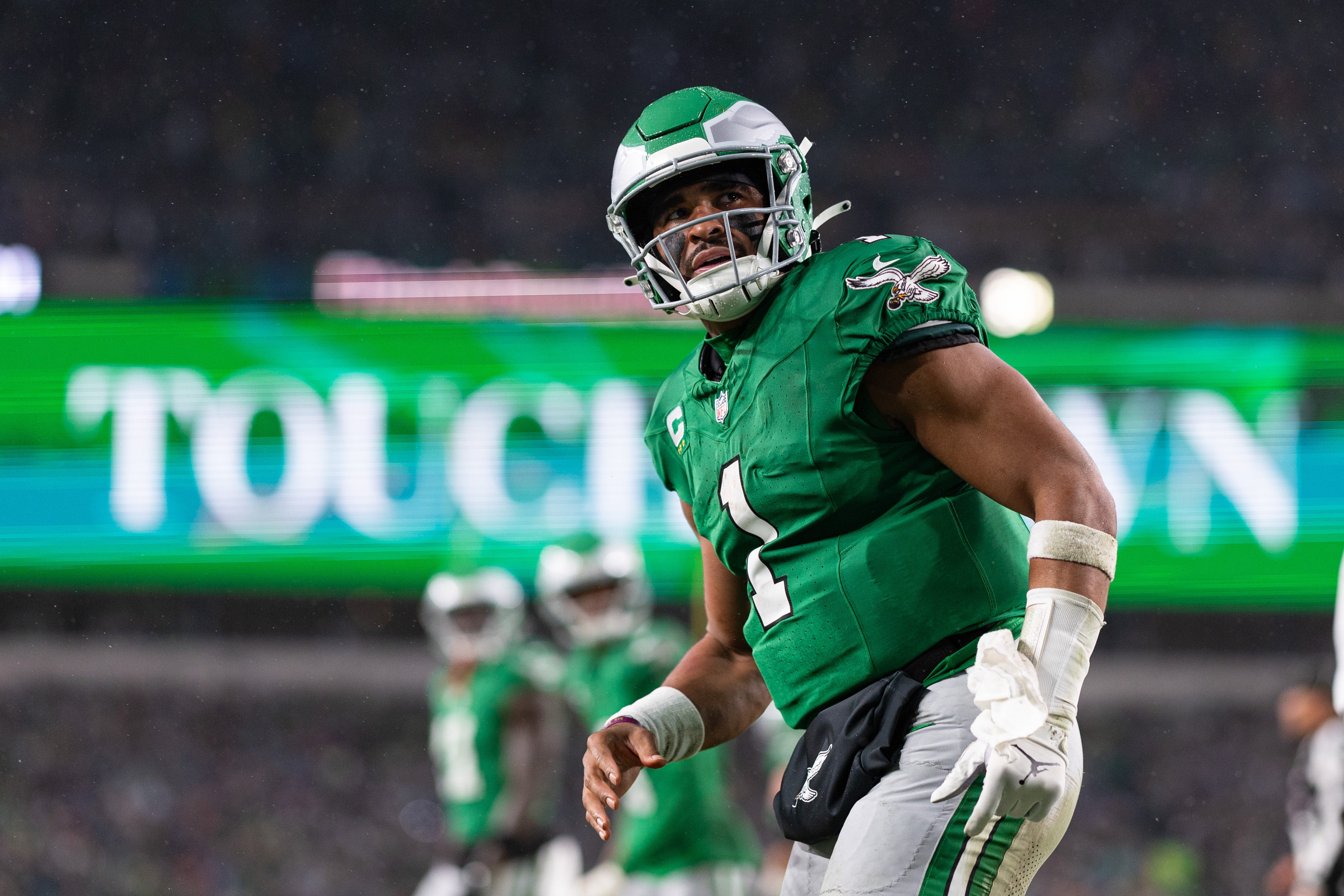 Philadelphia Eagles quarterback Jalen Hurts (1) looks into the stands after scoring a touchdown against the Buffalo Bills during the first quarter at Lincoln Financial Field.