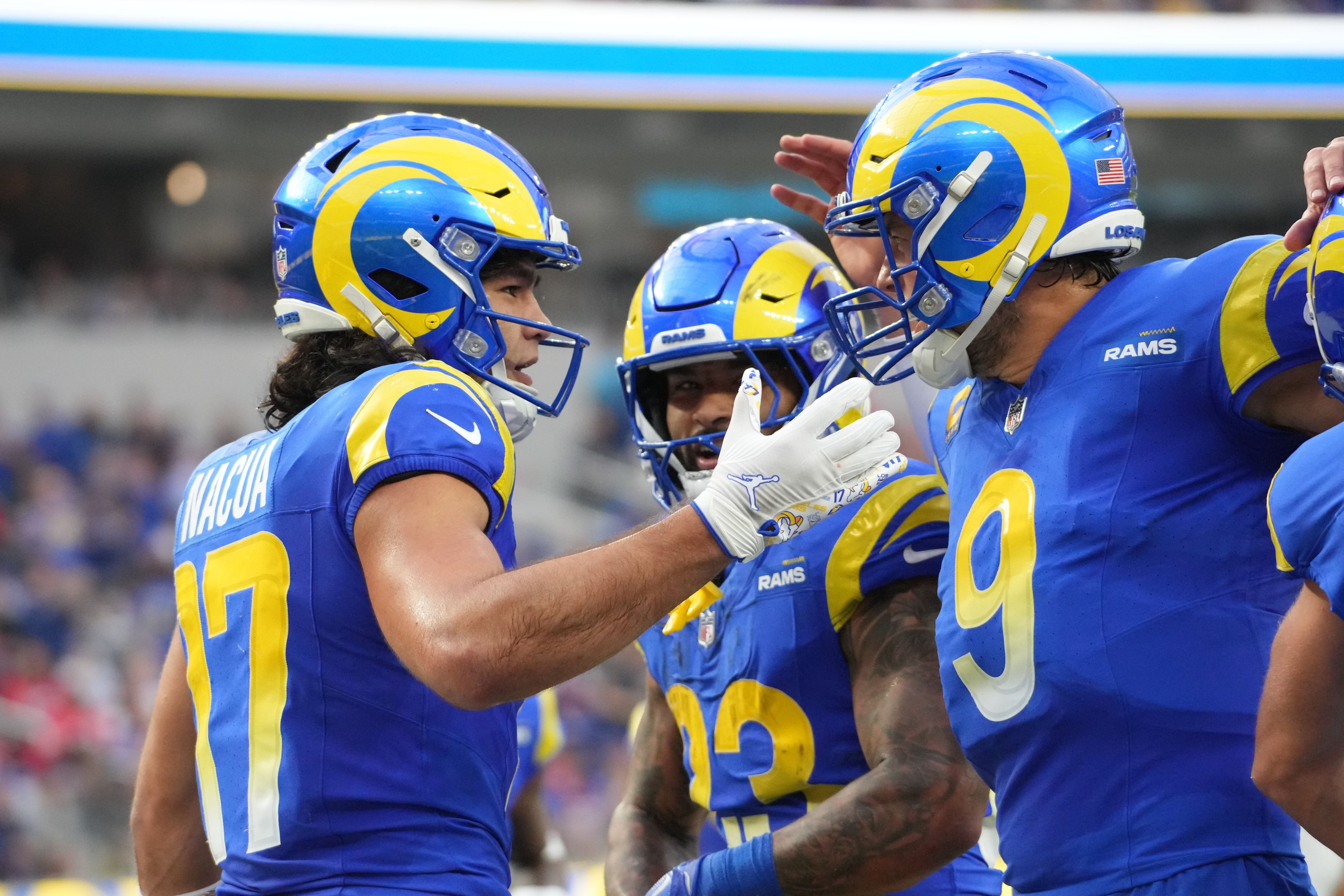 Dec 8, 2024; Inglewood, California, USA; Los Angeles Rams wide receiver Puka Nacua (17) celebrates with quarterback Matthew Stafford (9) and running back Kyren Williams (23) after scoring a touchdown run in the second quarter against the Buffalo Bills at SoFi Stadium.